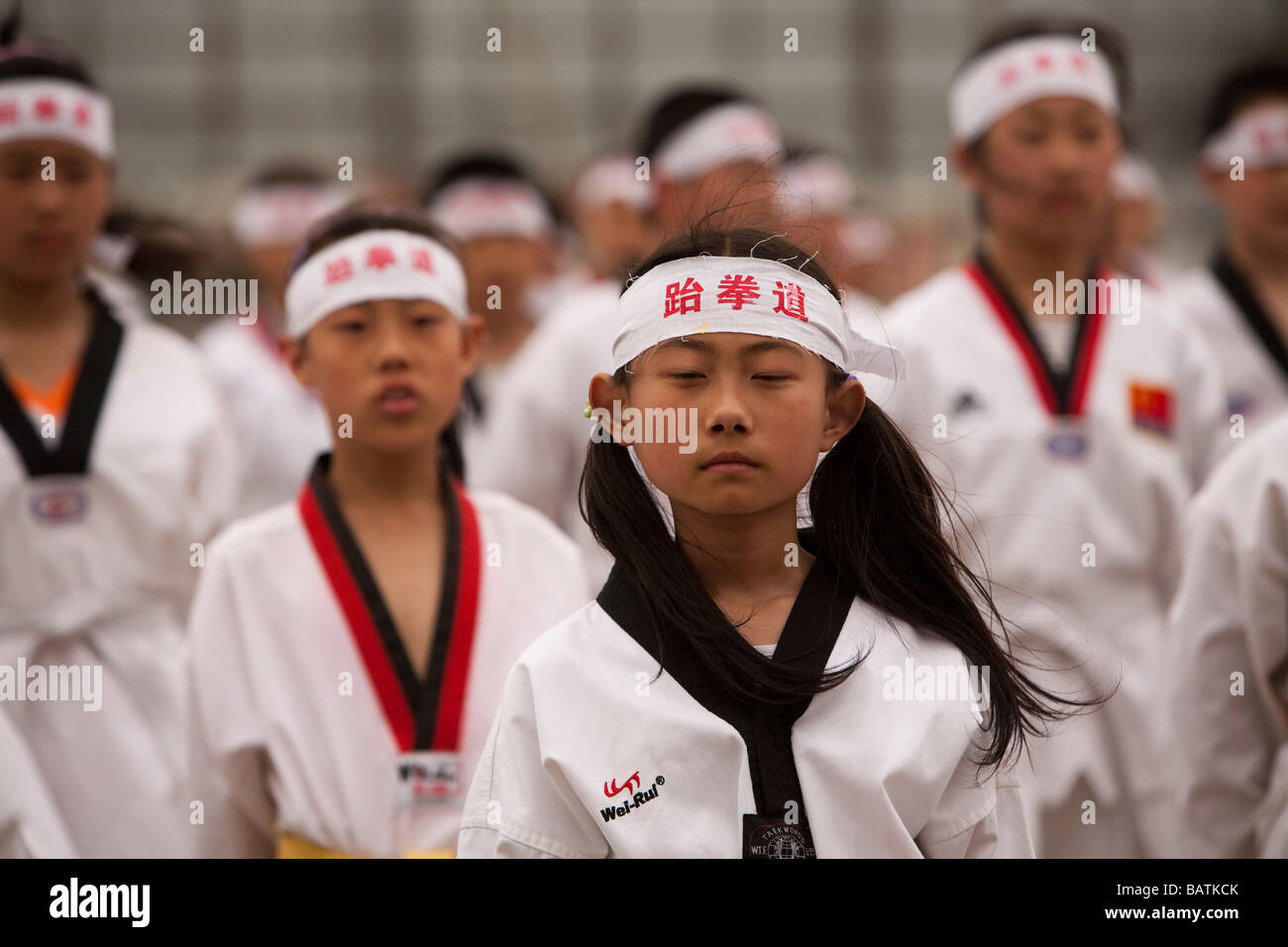 Schülerinnen und Schüler an die Stadt Sportstadion, Proben für die Parade vor Parteiführern, Changchun, Jilin Province, China Stockfoto