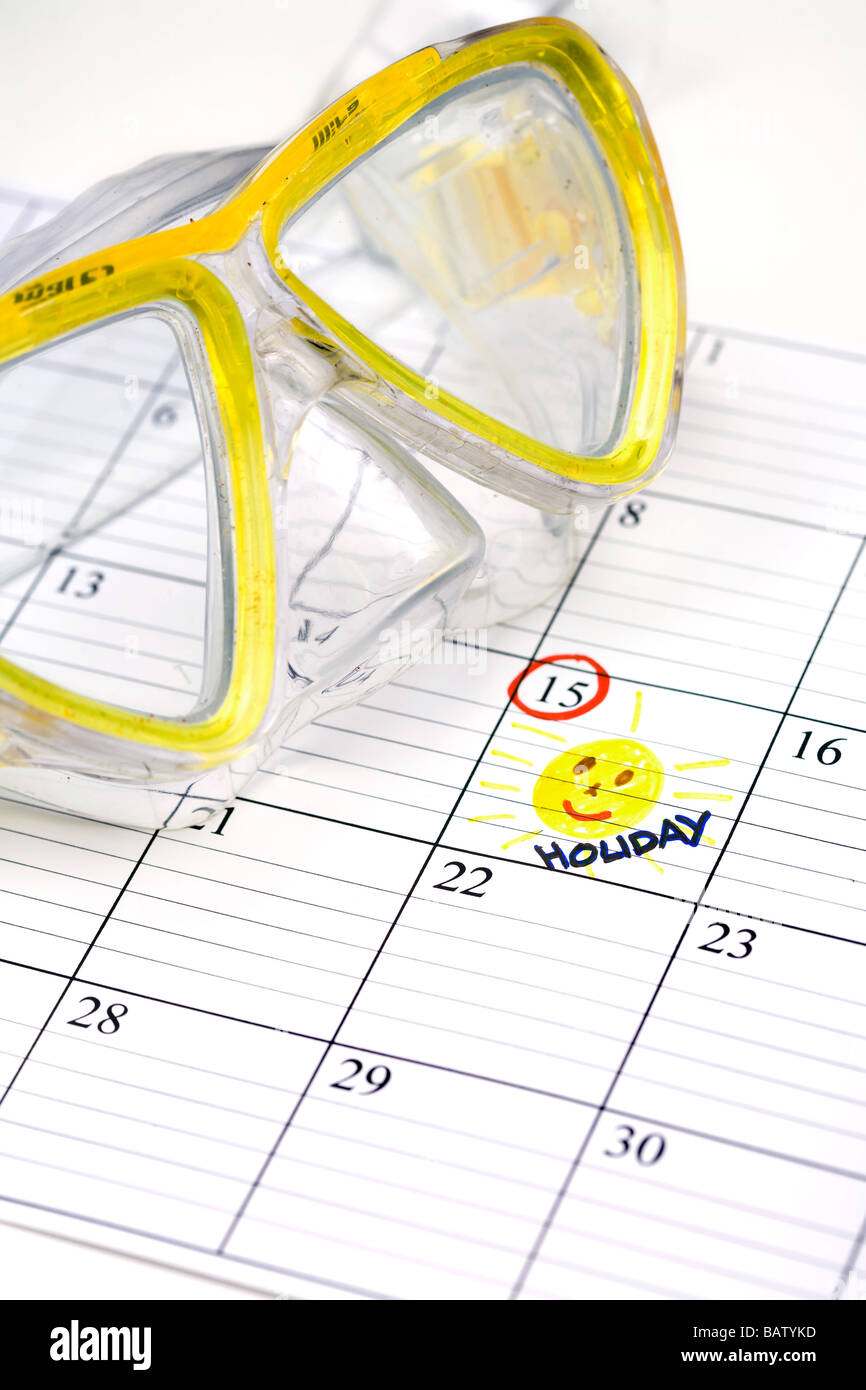 Stillleben mit Tauch Brille mit Feiertagen im Kalender markiert Stockfoto