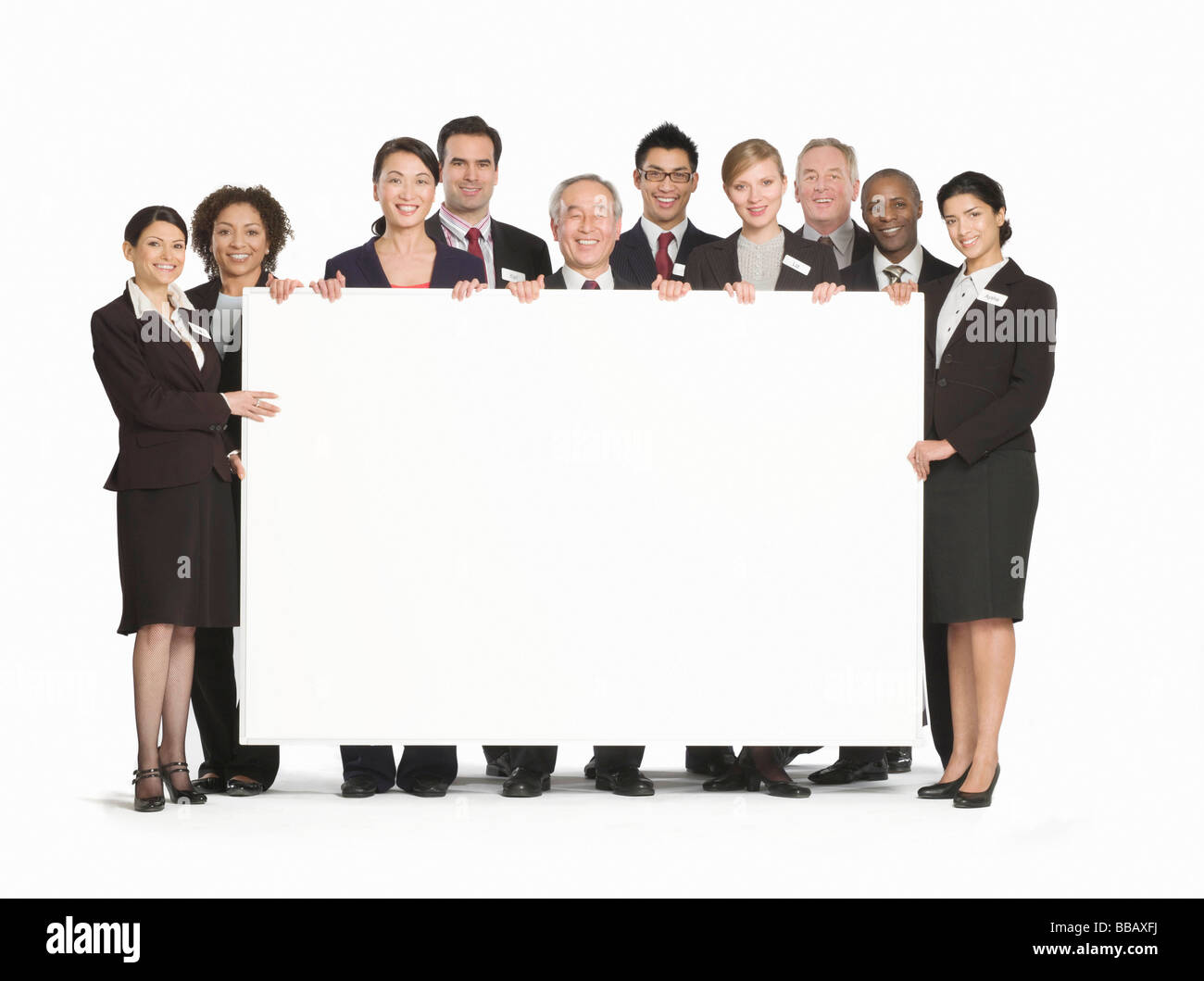 Eine Business-Gruppe hält eine weiße Tafel Stockfoto