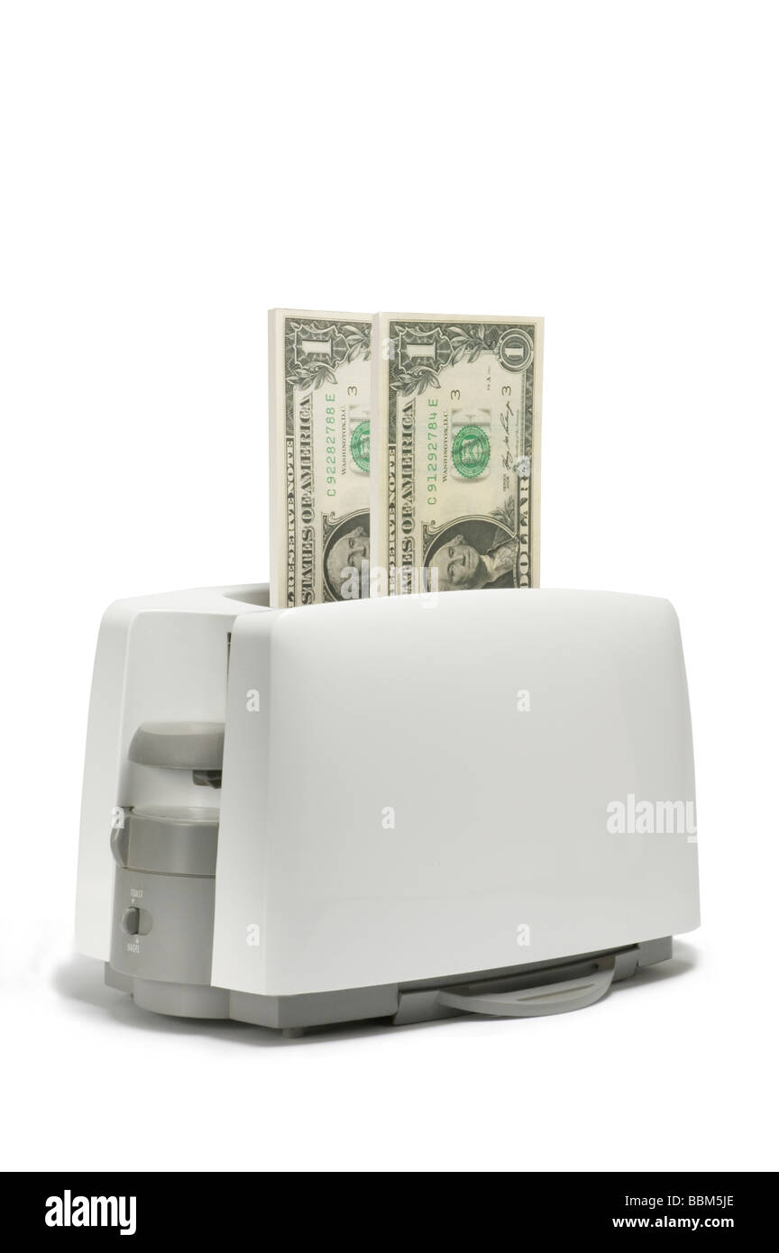 Amerikanische Dollar-Scheine in den toaster Stockfoto
