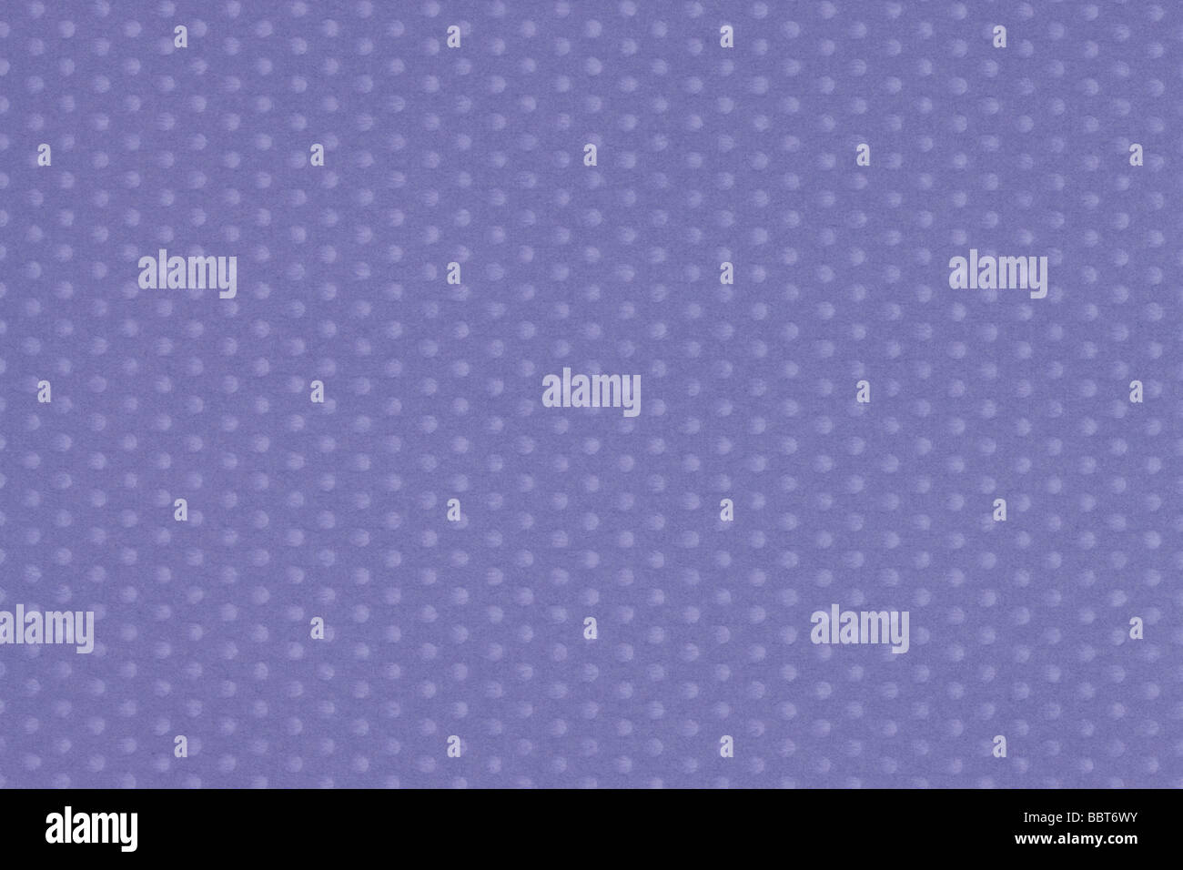 Polka Dots auf lila Hintergrund Stockfoto