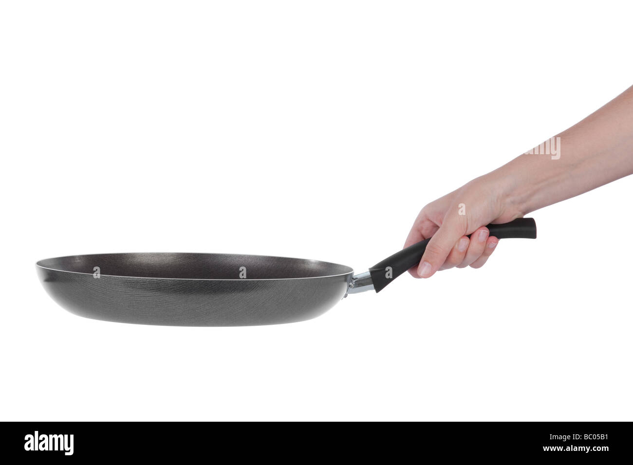 Hand mit einer Teflon-Pfanne isoliert auf weißem Hintergrund Stockfoto