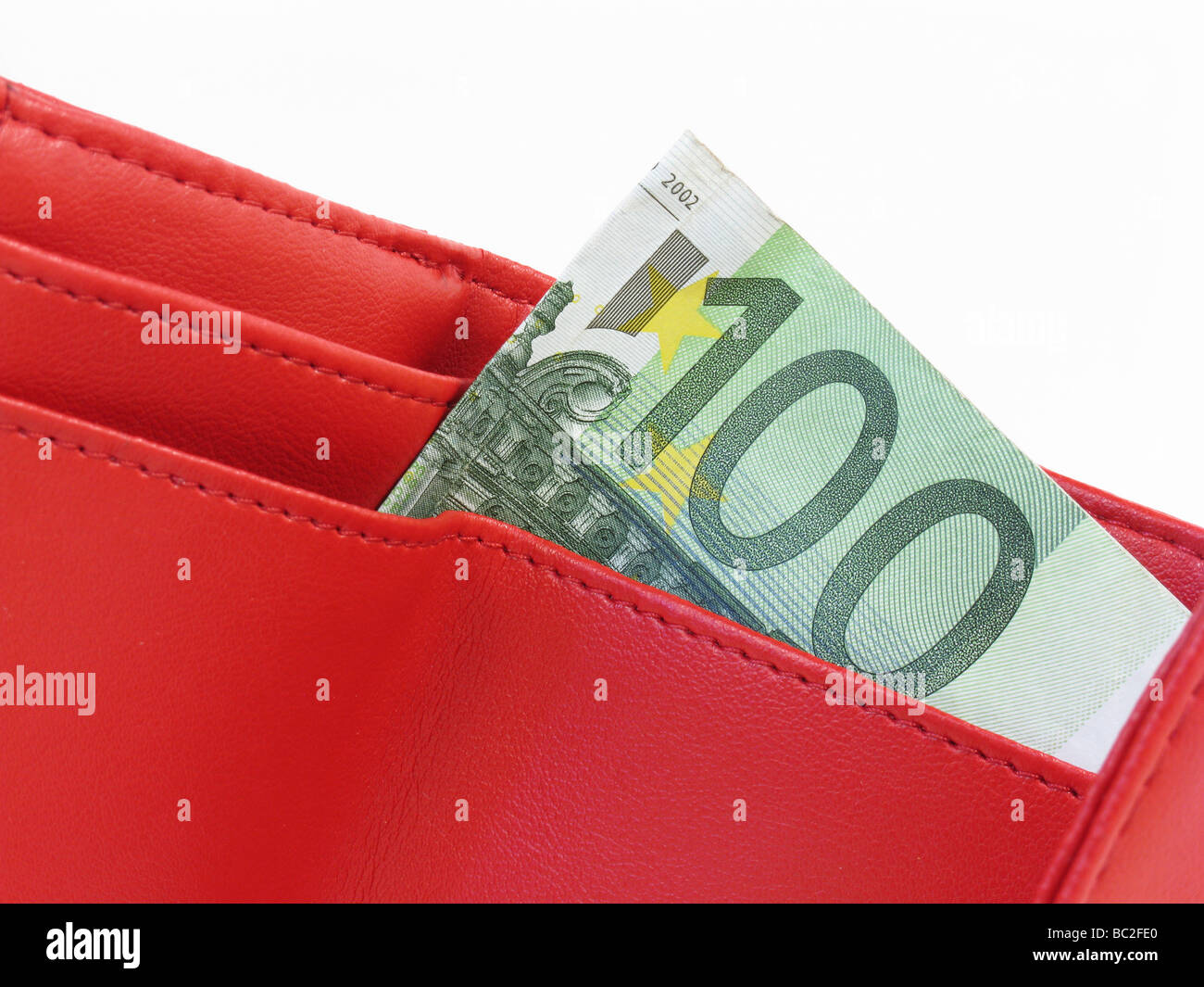 rote Leder-Portemonnaie mit hundert Euro Stockfoto