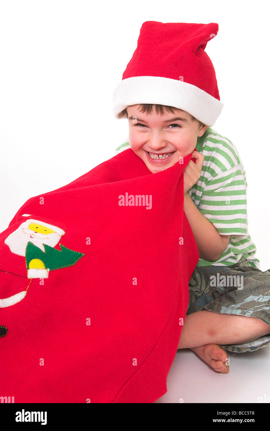 Kleiner Junge einen Santa Sack Stockfoto