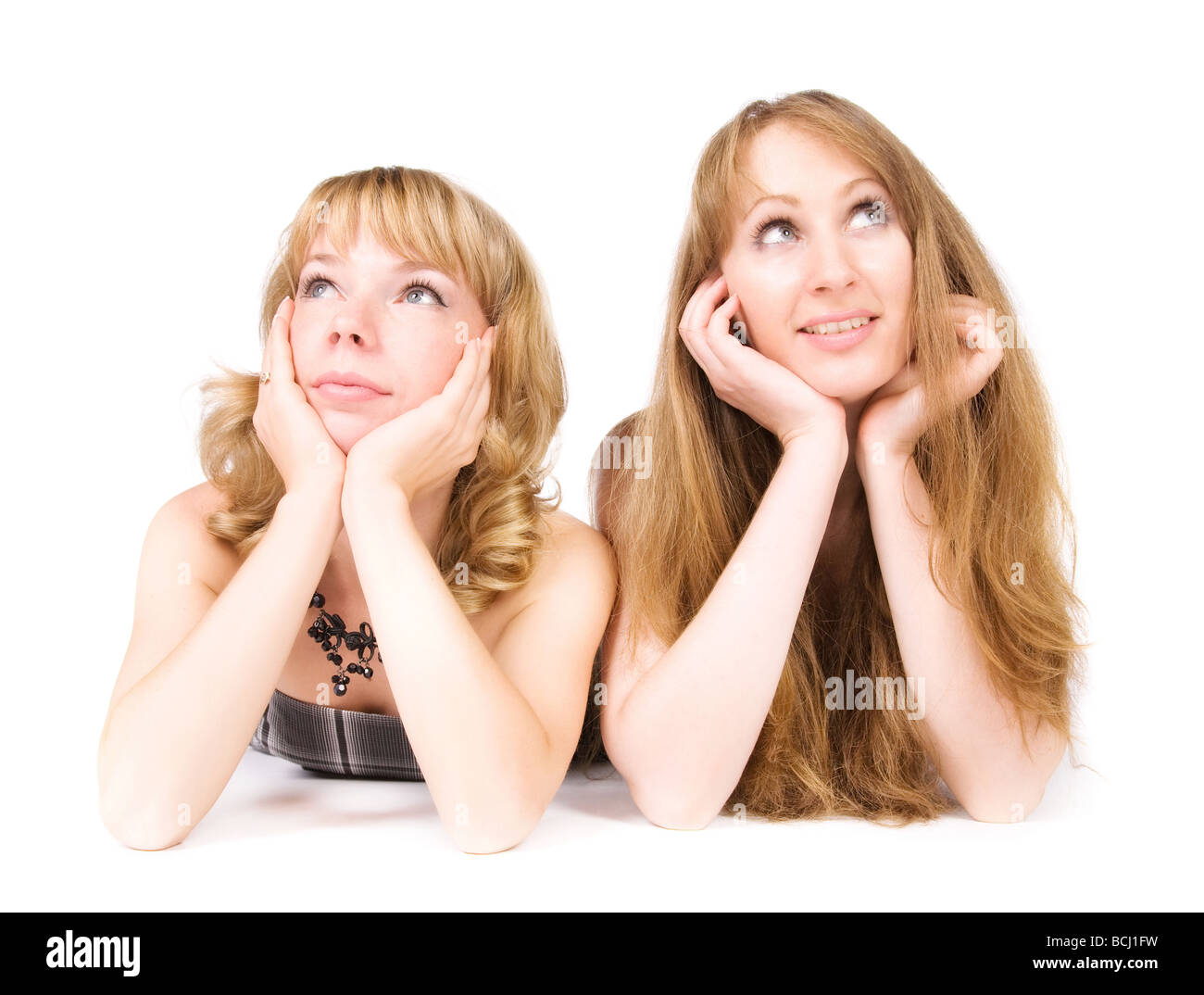 Zwei träumen Frauen isoliert auf weiß Stockfoto