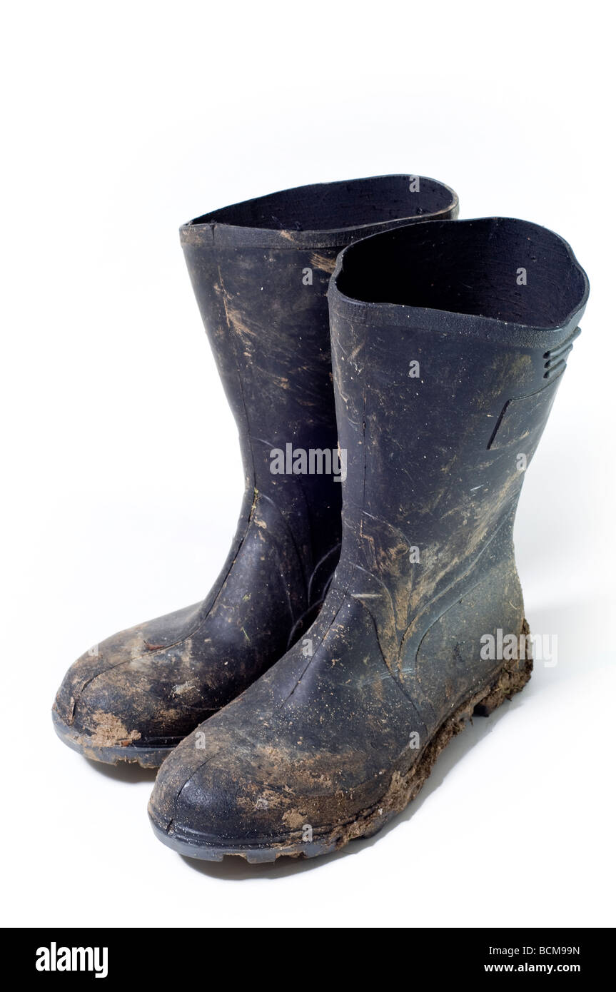 paar von schmutzigen Gummistiefel Stockfoto