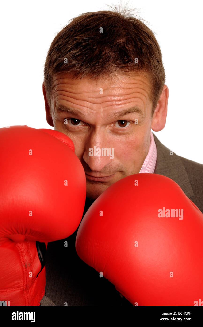 Geschäftsmann mit Boxhandschuhen Stockfoto