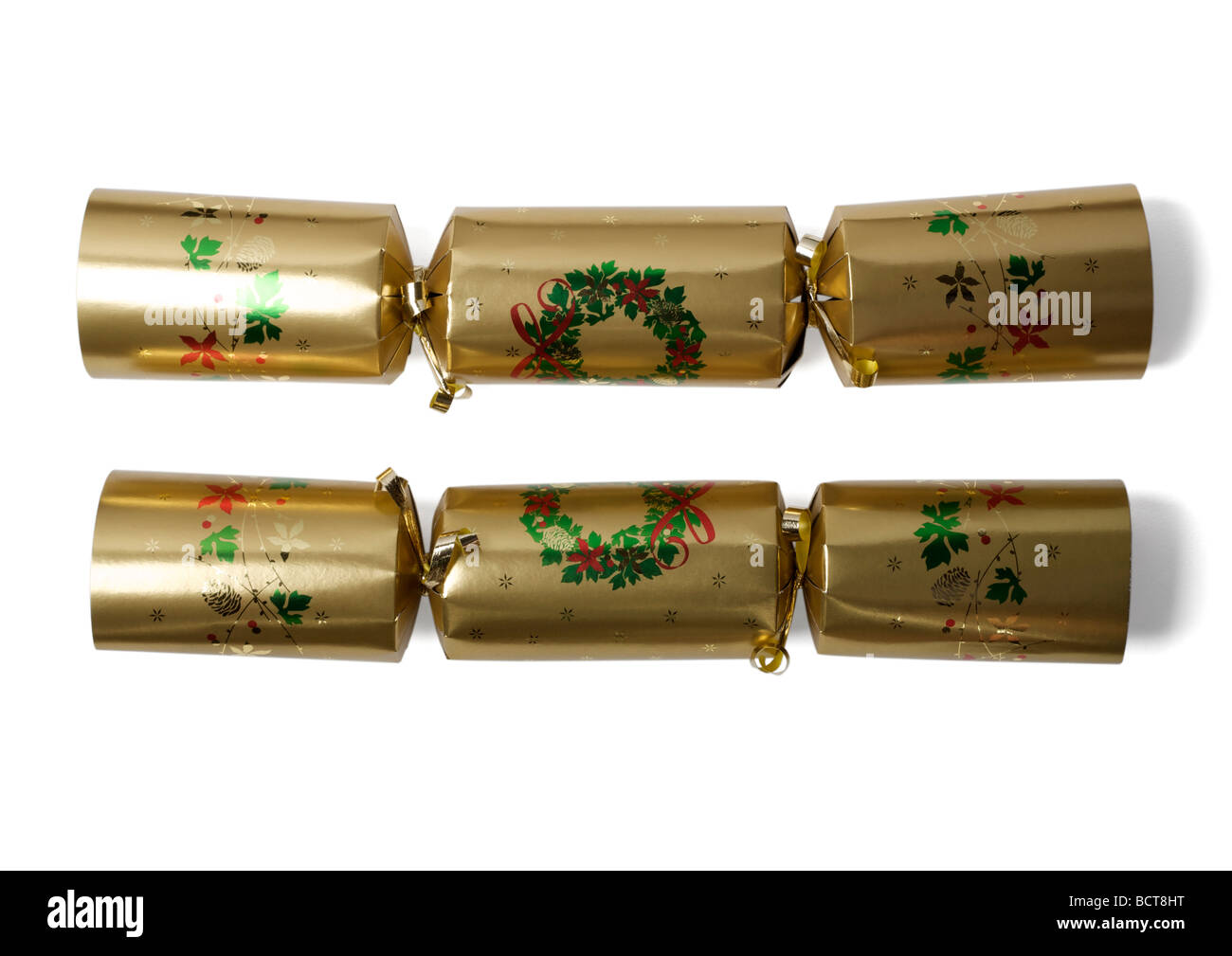 Gold Christmas Cracker auf weißem Hintergrund Stockfoto