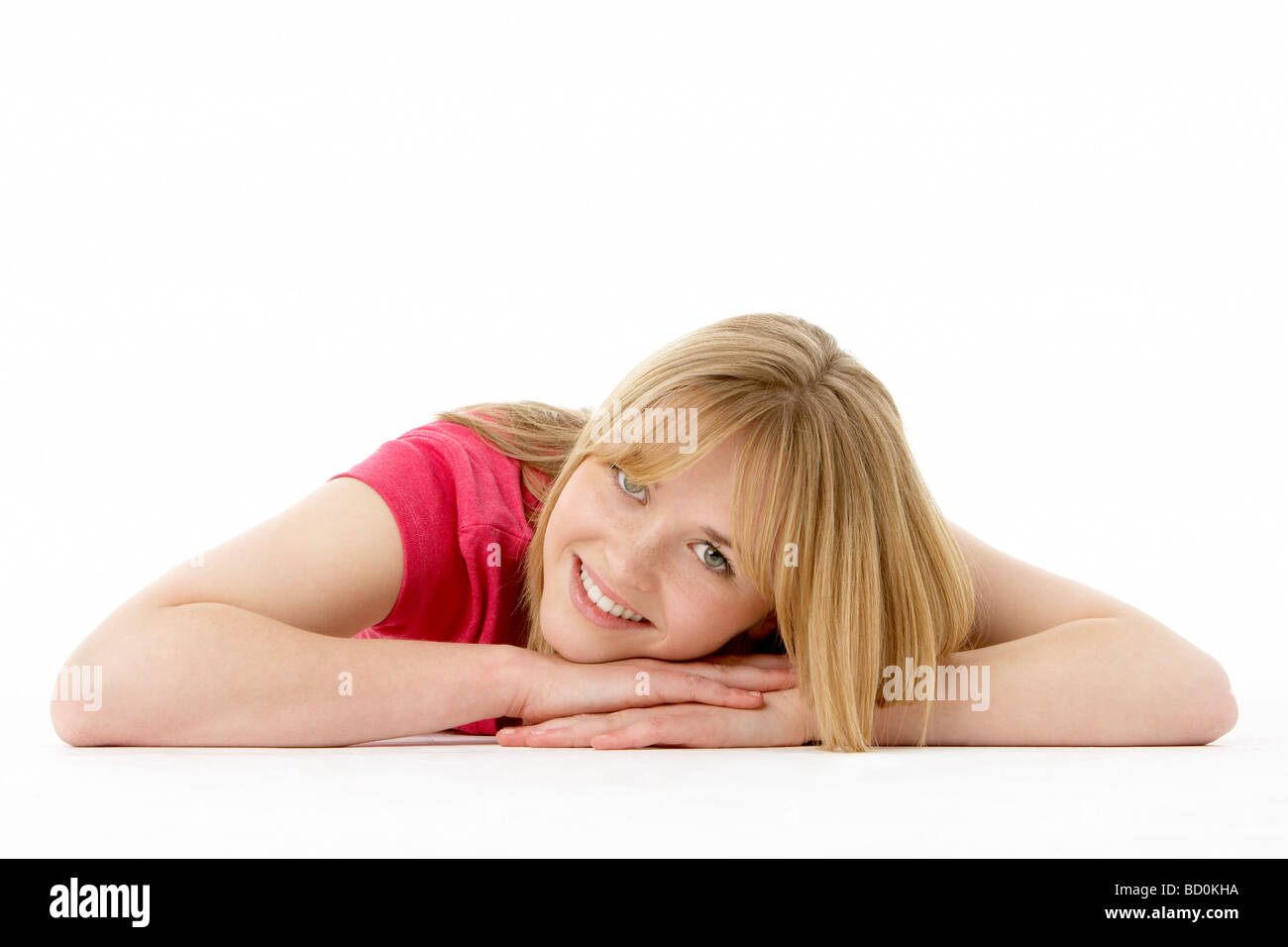 Studioportrait Of Smiling Teenager-Mädchen Stockfoto