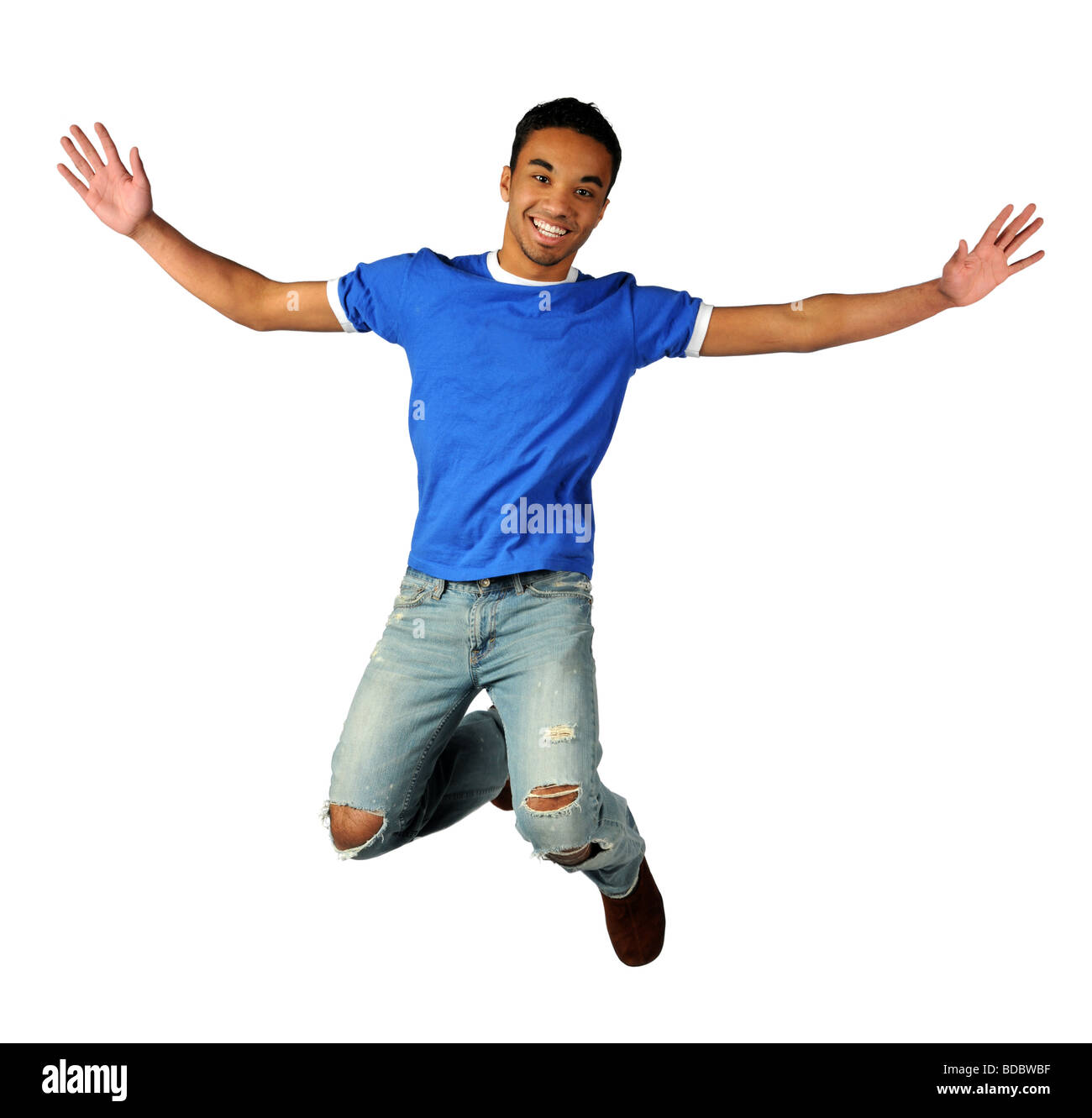 Junger Mann springen über einen weißen Hintergrund isoliert Stockfoto