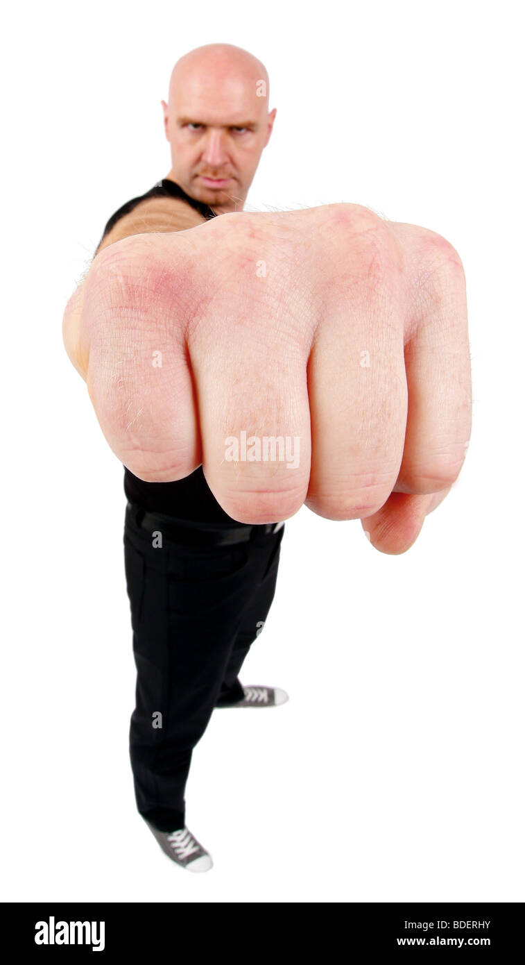 Glatze Mann, der seine Faust in die Kamera hält unter der Leitung Stockfoto