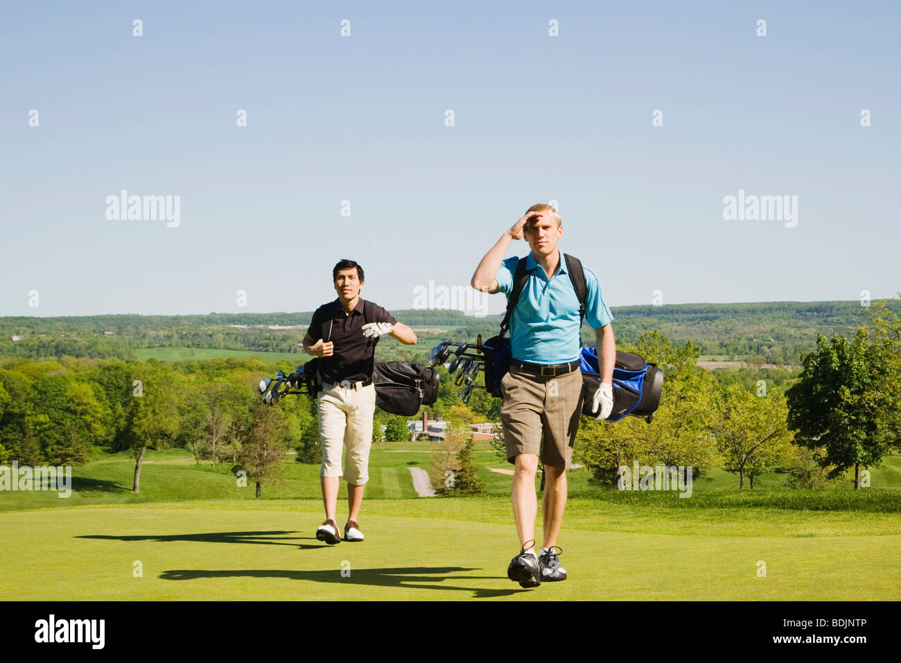 Männer am Golfplatz Stockfoto