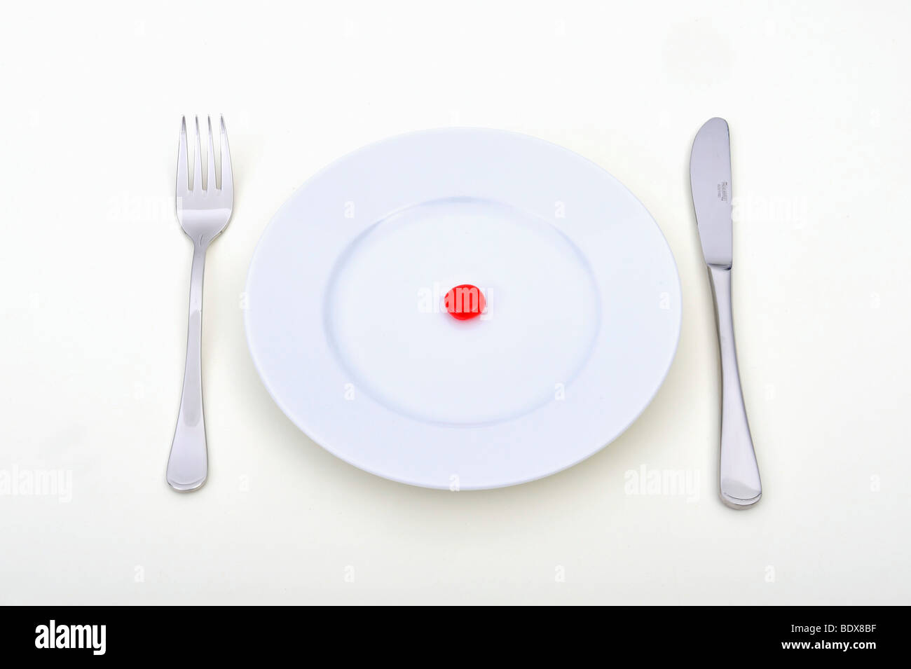 Symbolisches Bild für synthetische Nahrungsmittel, Pille Verbrauch, Drogenmissbrauch, Ernährung Stockfoto