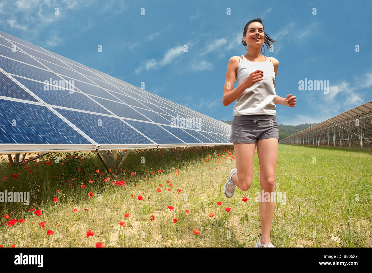 Frau Joggen Solarpanel Stockfoto