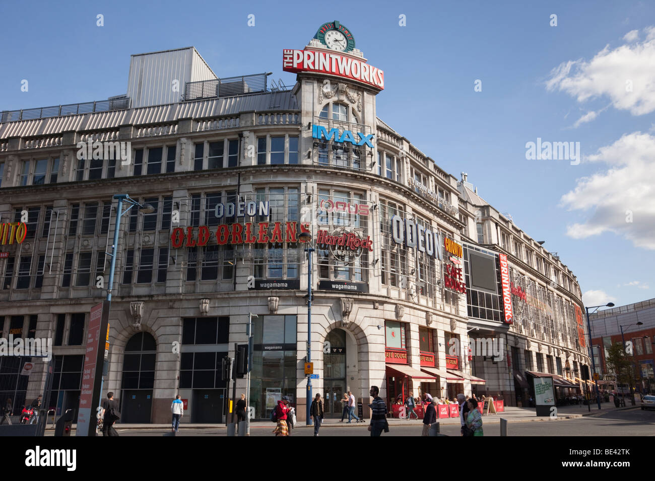 Corporation Street, Manchester, England, Vereinigtes Königreich, Europa. Die Printworks Gebäude und die Uhr in der Innenstadt Stockfoto