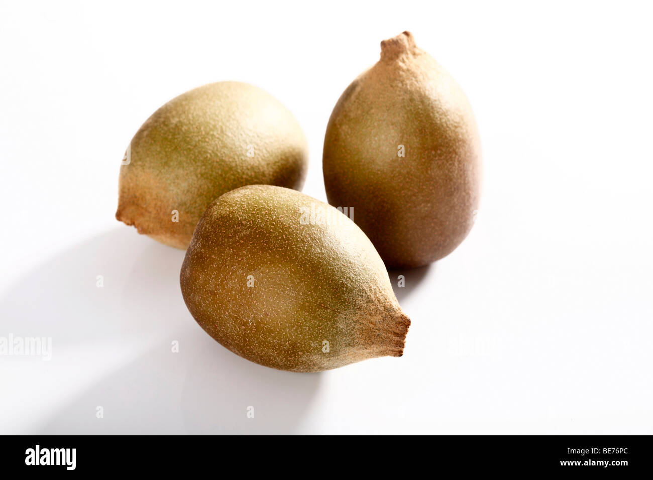 Drei gold kiwis Stockfoto