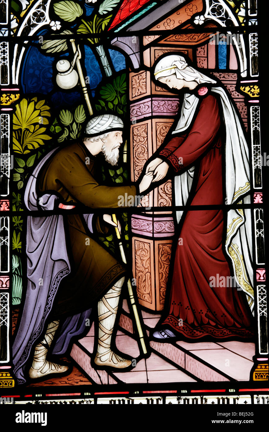 Detail eines Buntglasfensters von Friedrich Preedy, das eine der Taten der korporalen Barmherzigkeit darstellt, Kirche der heiligen Jungfrau Maria, Gunthorpe, Norfolk Stockfoto