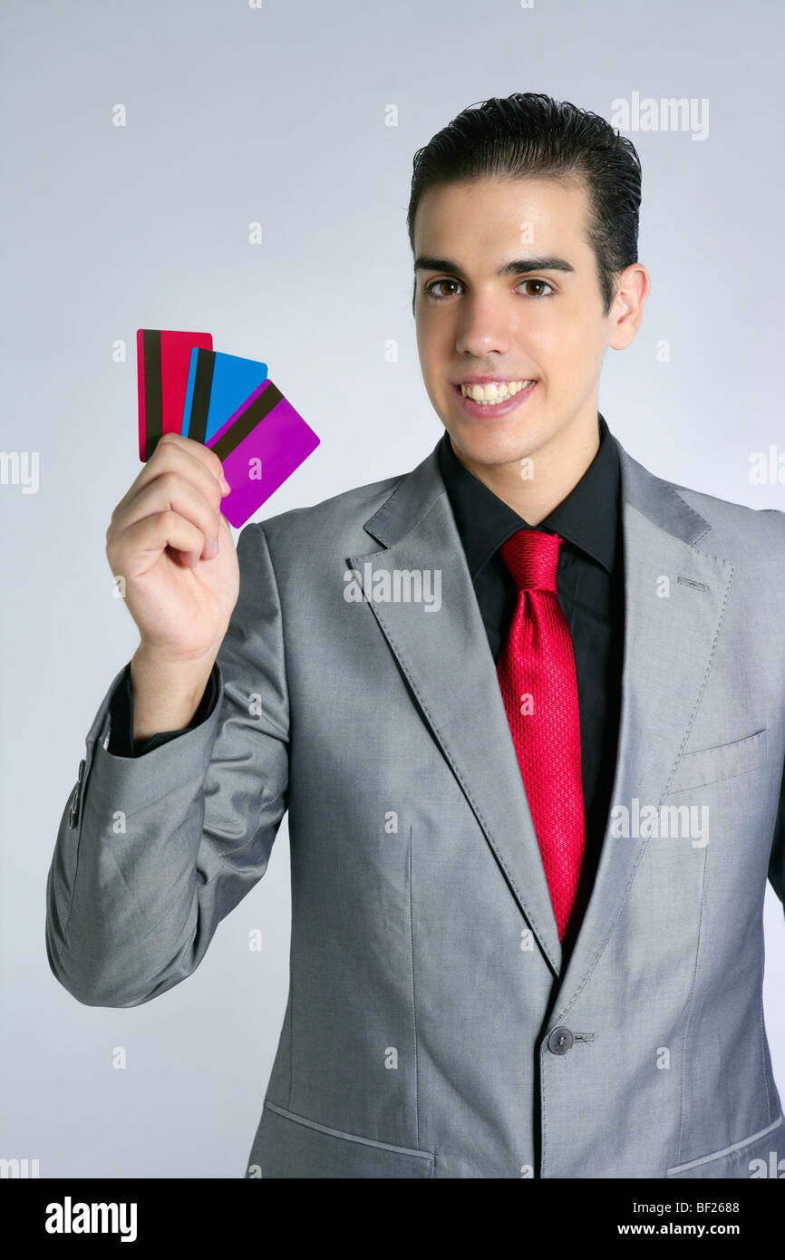 Junge Unternehmer mit drei Kreditkarten in der hand Stockfoto
