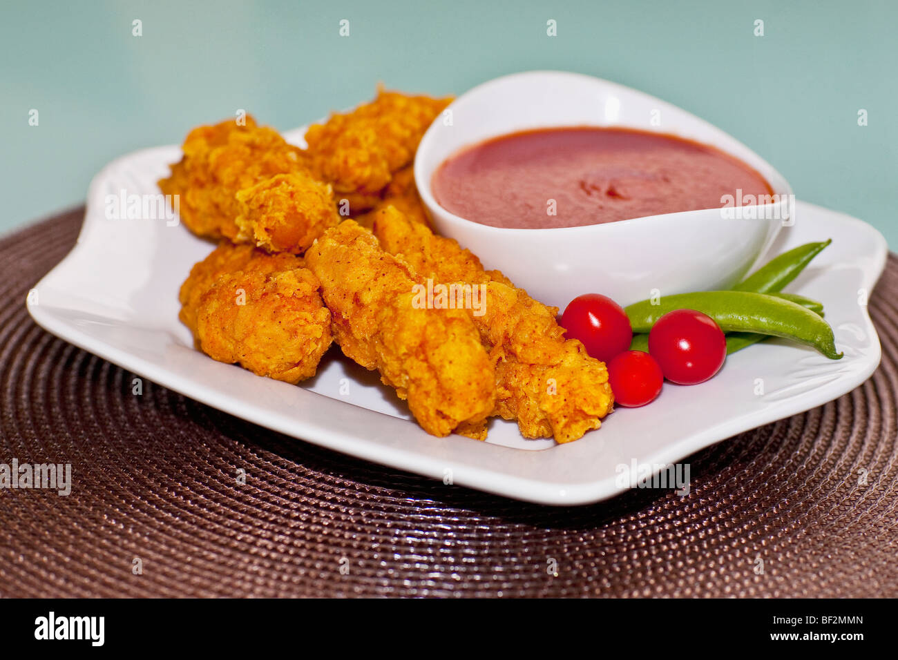 Teig gebraten Huhn mit ketchup Stockfoto