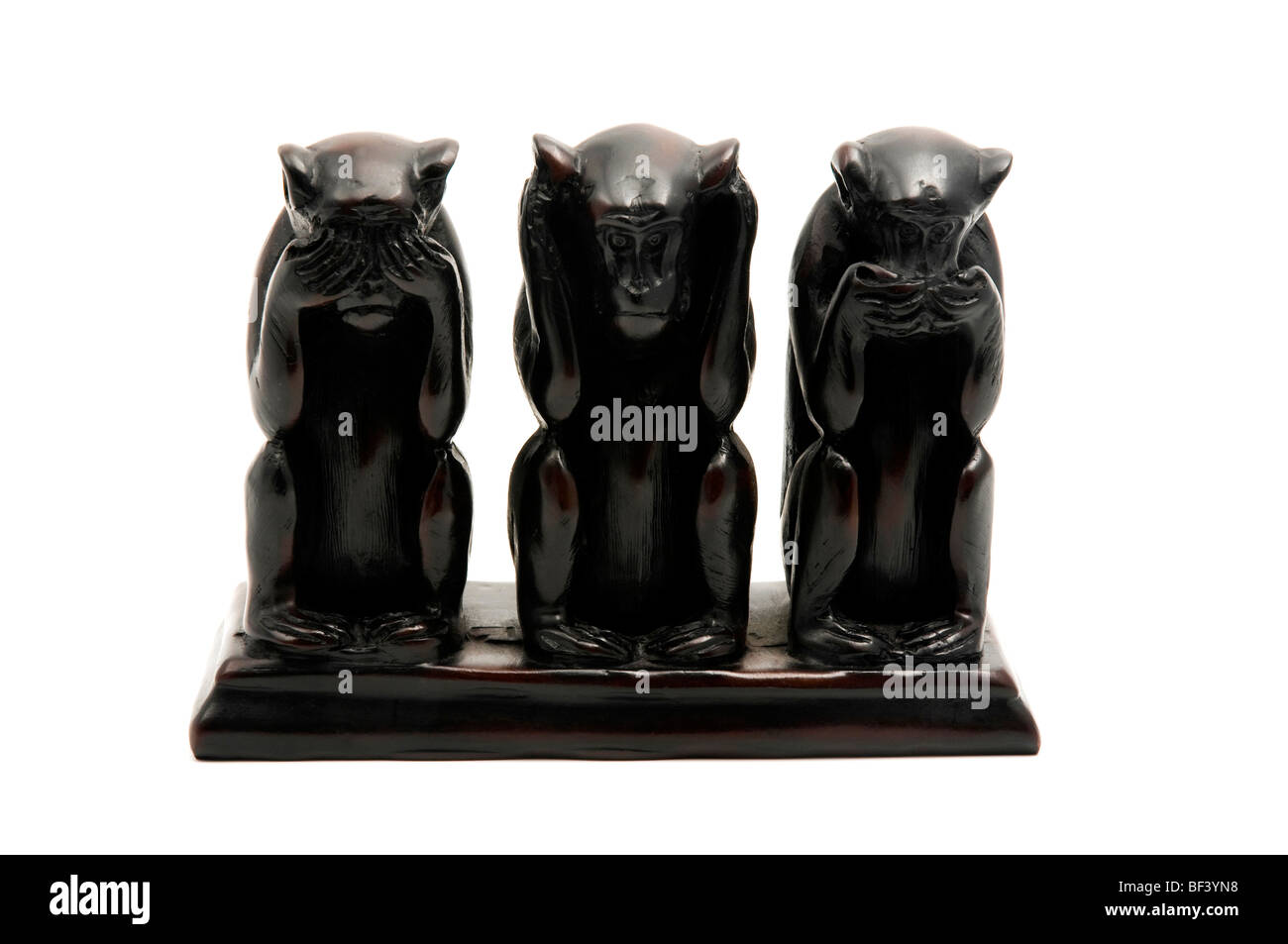 Die drei weisen Affen auf weißem Hintergrund Stockfoto