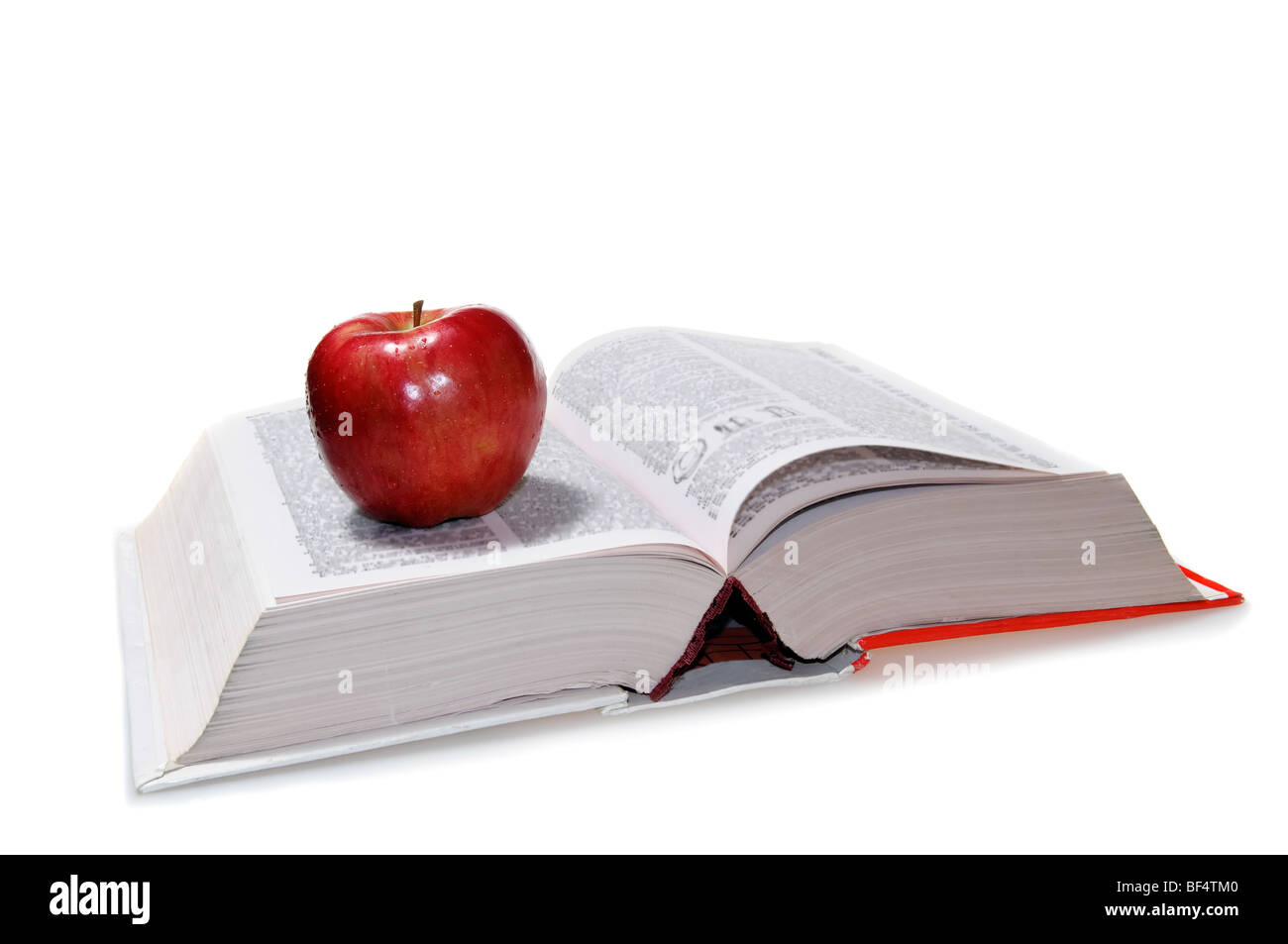 Big Book und einen roten Apfel drauf Stockfoto