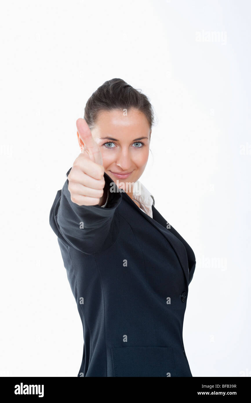 glücklich Geschäftsfrau im schwarzen Anzug, Daumen nach oben zeigen Stockfoto