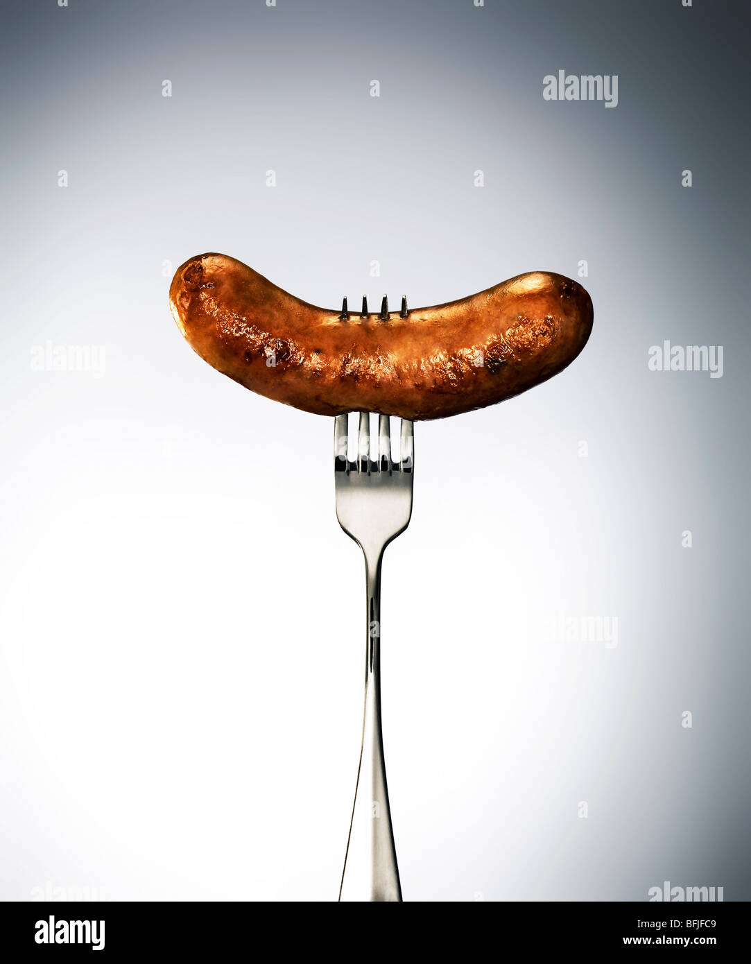 Wurst auf einer Gabel Stockfoto