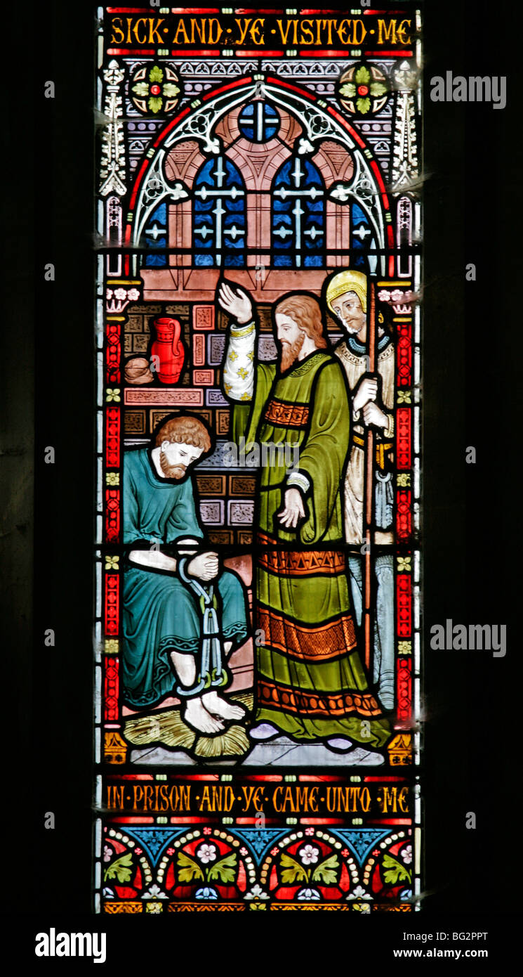Detail eines Buntglasfensters von Frederick Preedy, das eine der sechs Gnadenakten darstellt, Church of St Andrew, Temple Grafton, Warwickshire Stockfoto