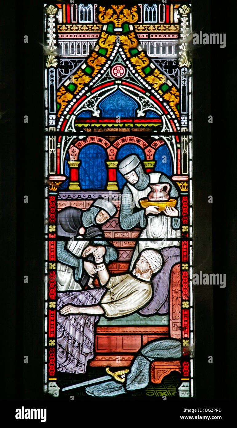 Detail eines Buntglasfensters von Frederick Preedy, das eine der sechs Gnadenakten darstellt, Church of St Andrew, Temple Grafton, Warwickshire Stockfoto
