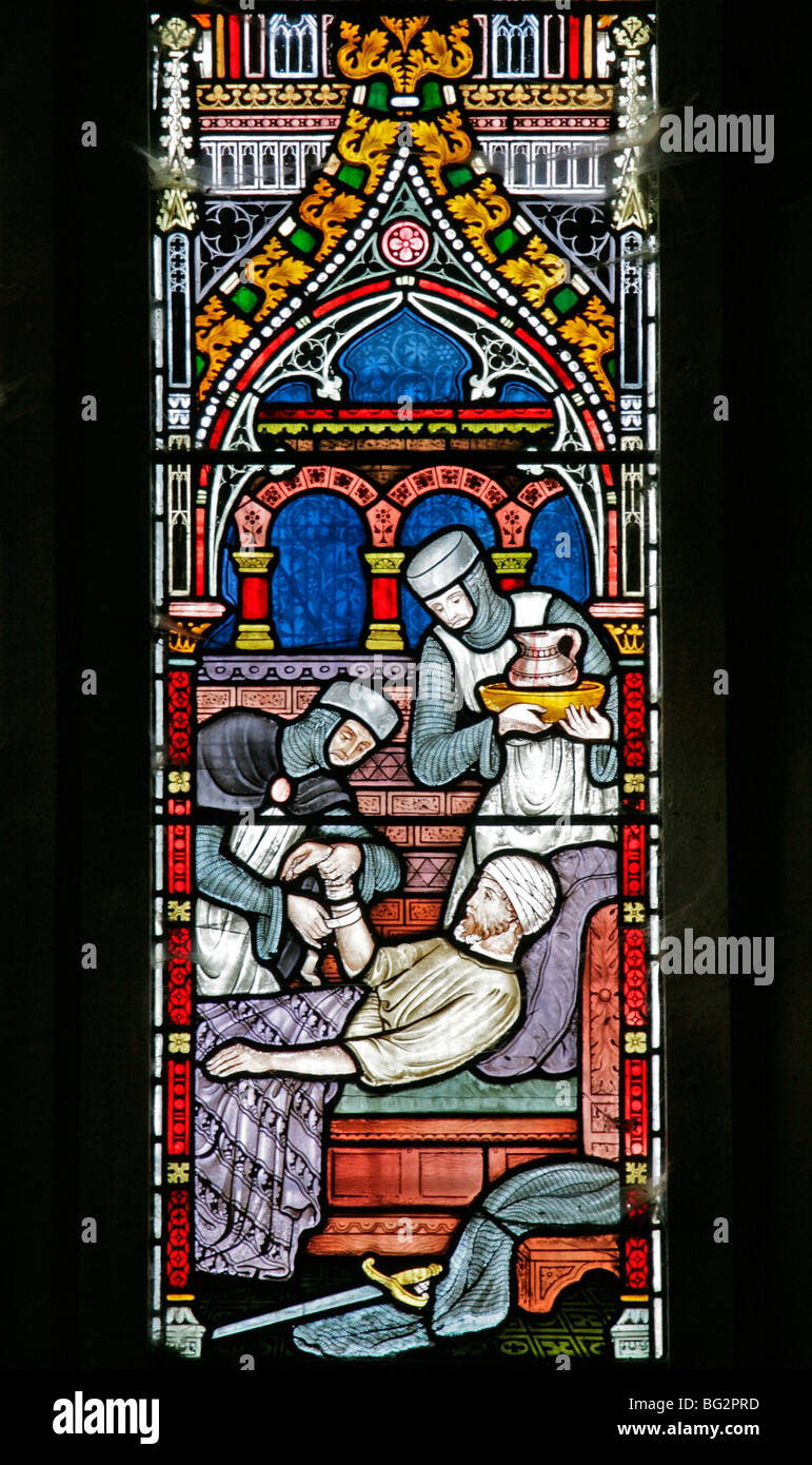 Detail eines Buntglasfensters von Frederick Preedy, das eine der sechs Gnadenakten darstellt, Church of St Andrew, Temple Grafton, Warwickshire Stockfoto