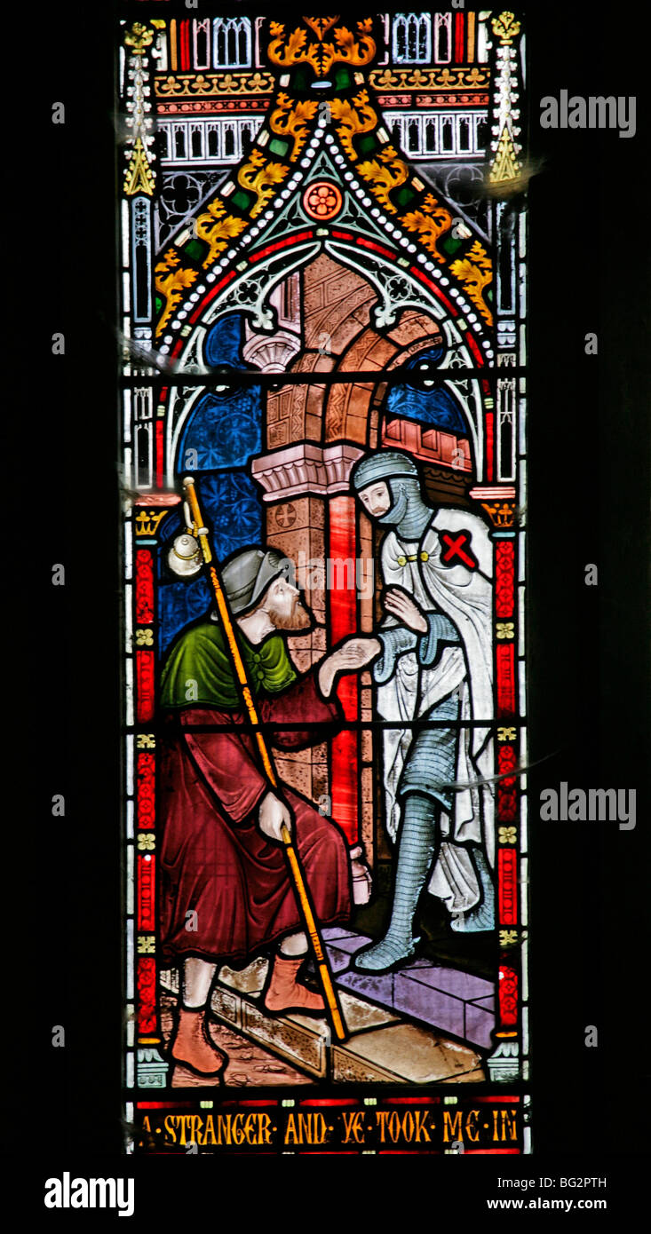 Detail eines Buntglasfensters von Frederick Preedy, das eine der sechs Gnadenakten darstellt, Church of St Andrew, Temple Grafton, Warwickshire Stockfoto