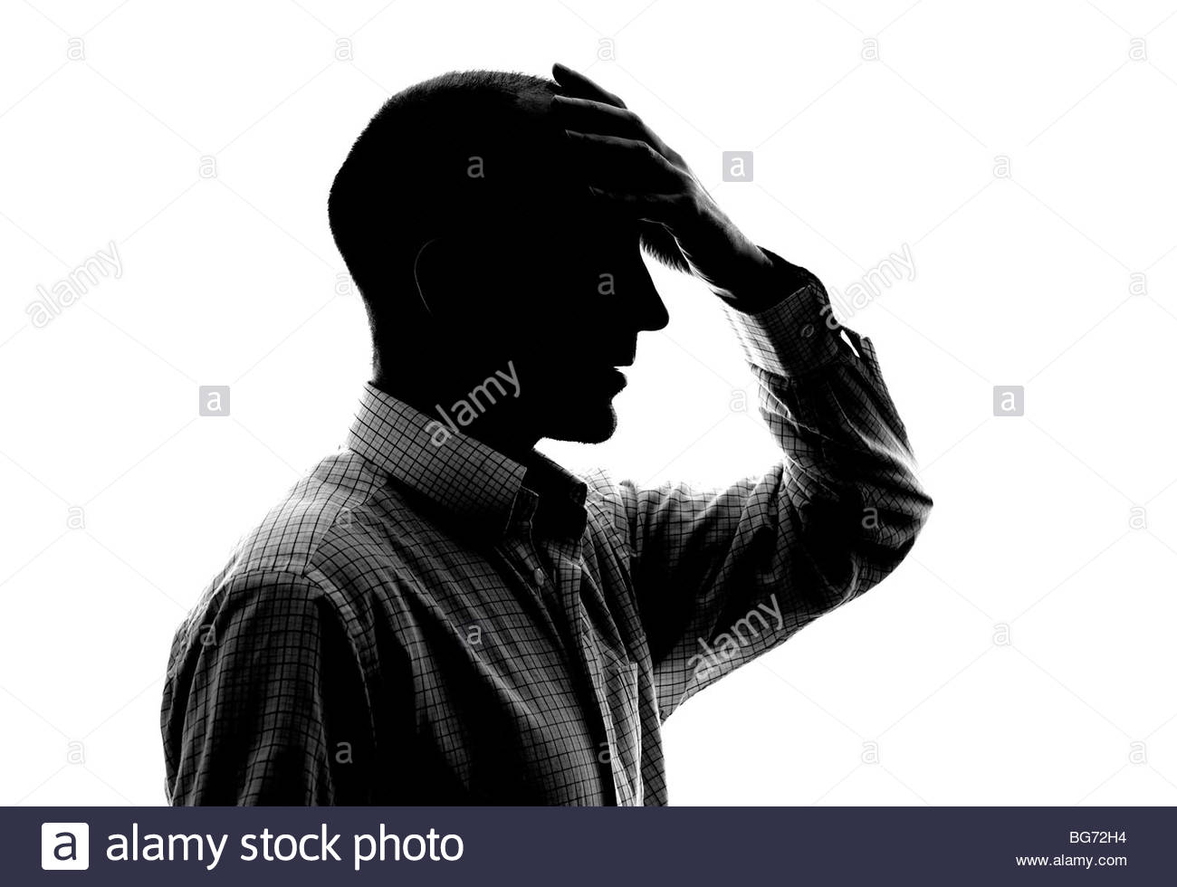 Silhouette Mann mit Kopf in Händen Stockfoto