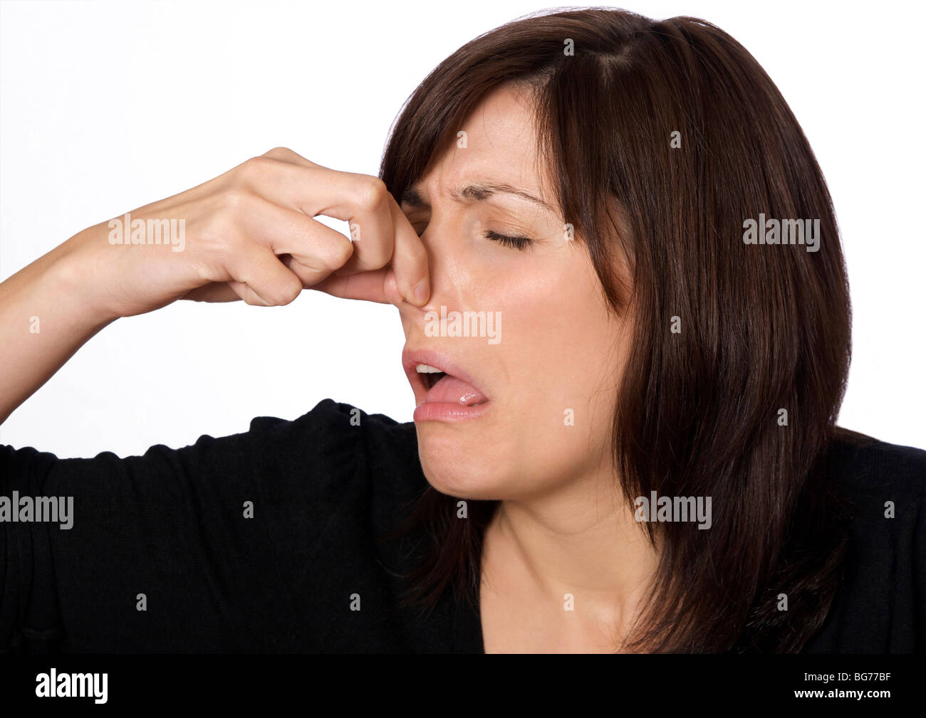 Frau mit ihrer Nase wegen einer schlechten Geruch Stockfoto