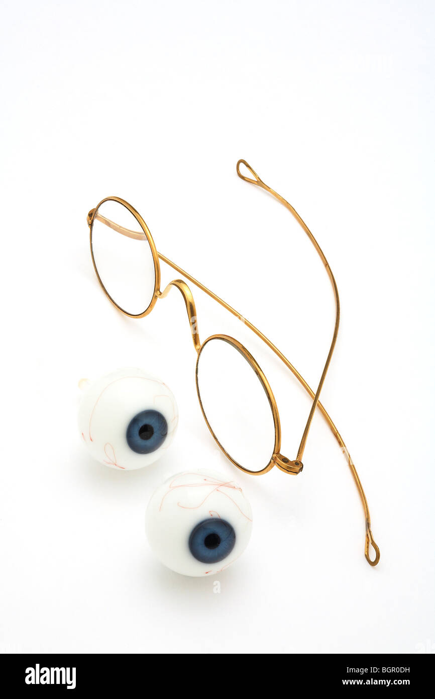 Antik Gold umrandeten Brille Brille zwei prothetischen Glasaugen Stockfoto
