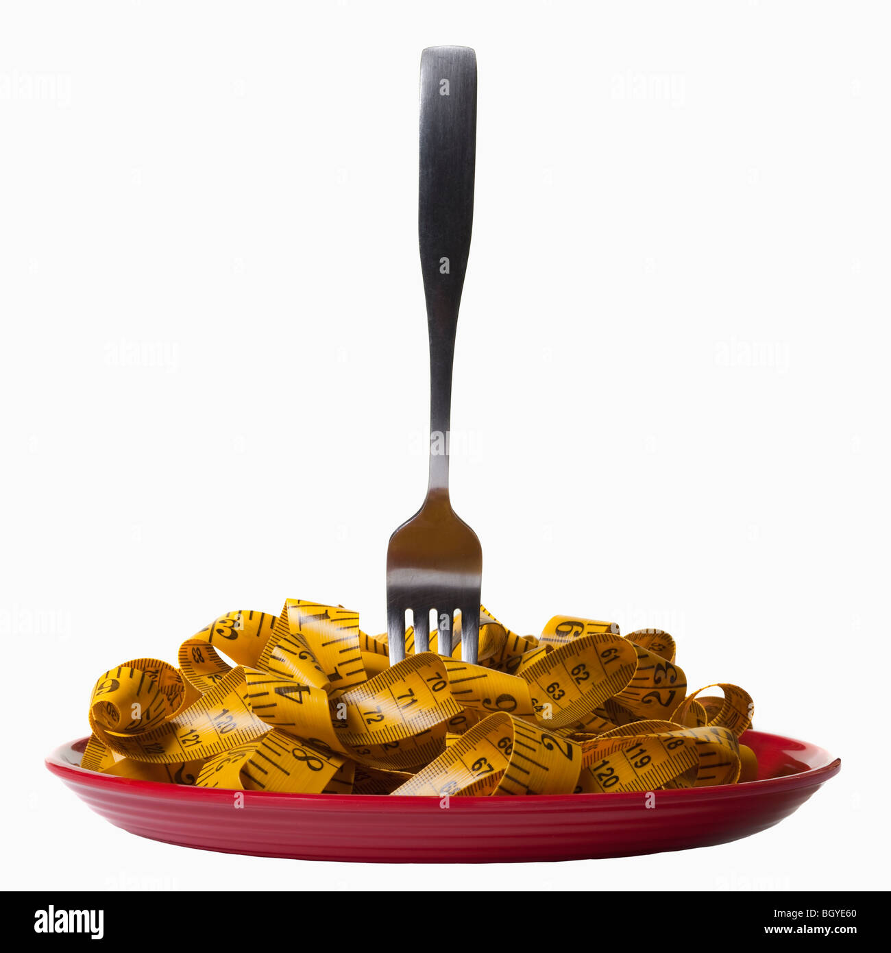 Maßband und Gabel auf Platte Stockfoto