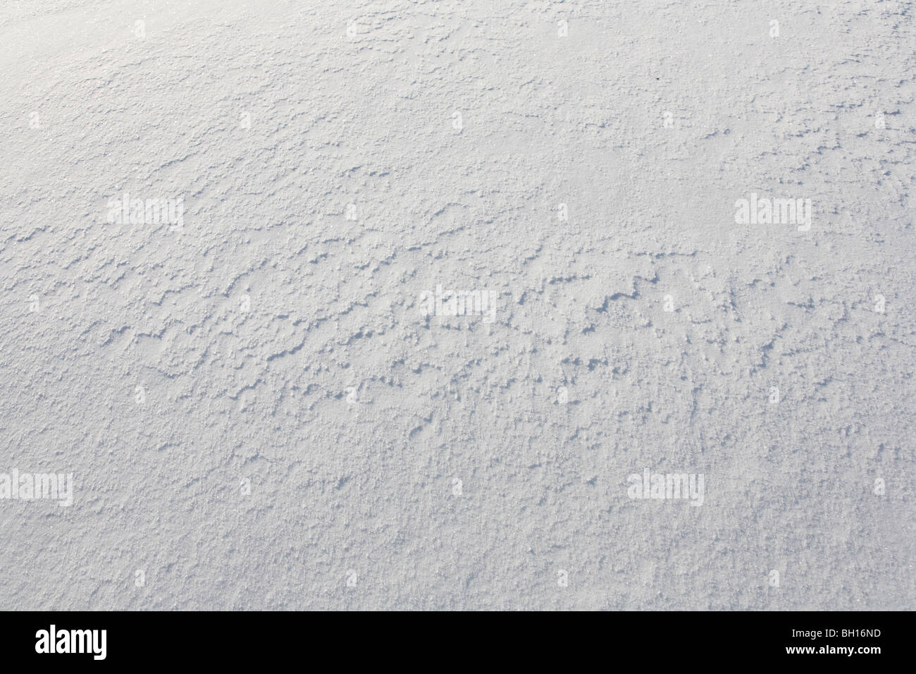 Schneeoberfläche. Winter-Textur für Ihr Kunstwerk. Schuss im Winter 2010 aufgenommen. Stockfoto