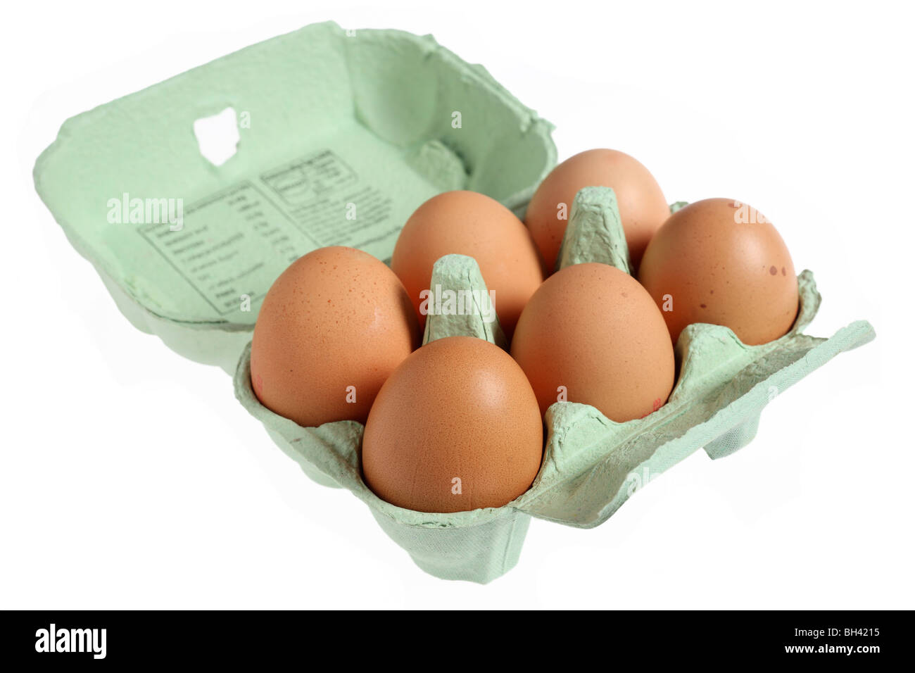 Sechs braune, aus Freilandhaltung Eiern in einer grünen papier Papiermache Egg box Stockfoto
