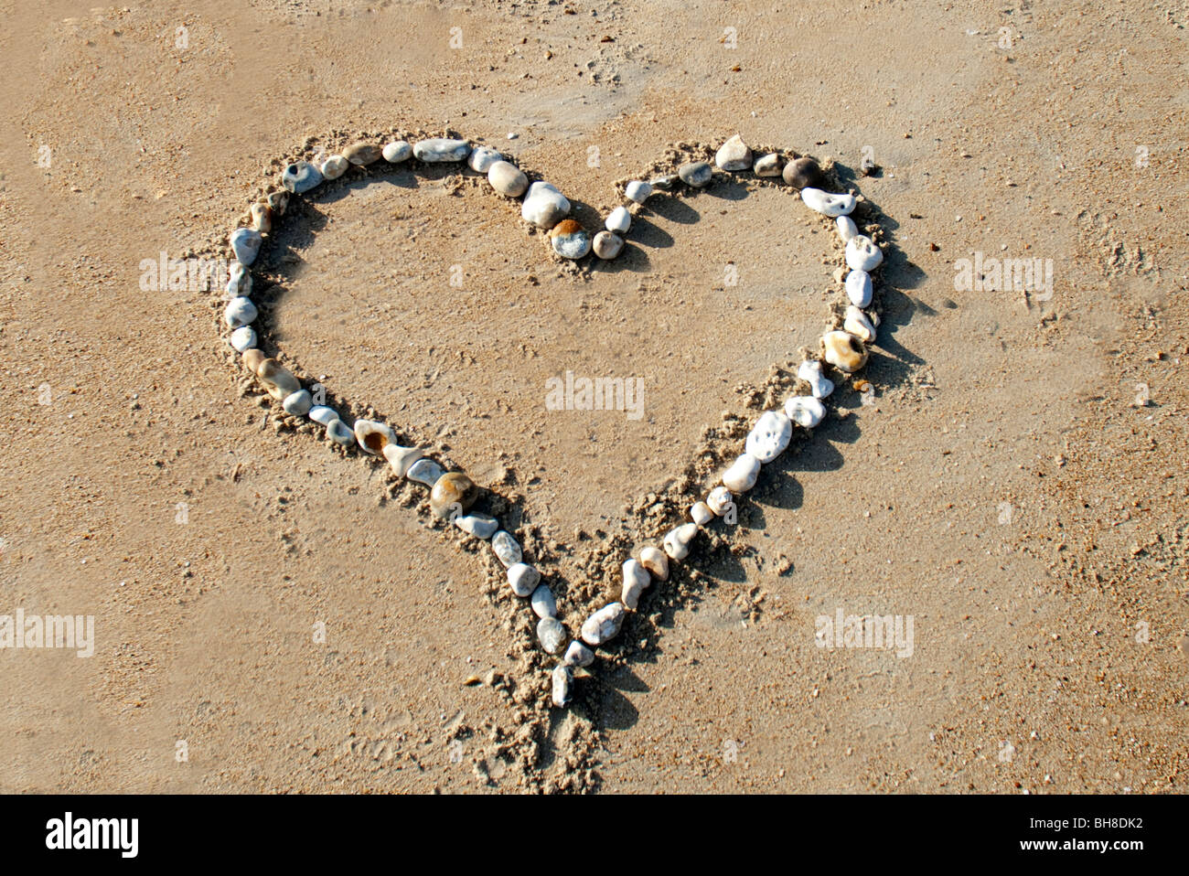 Liebe Herz im sand Stockfoto