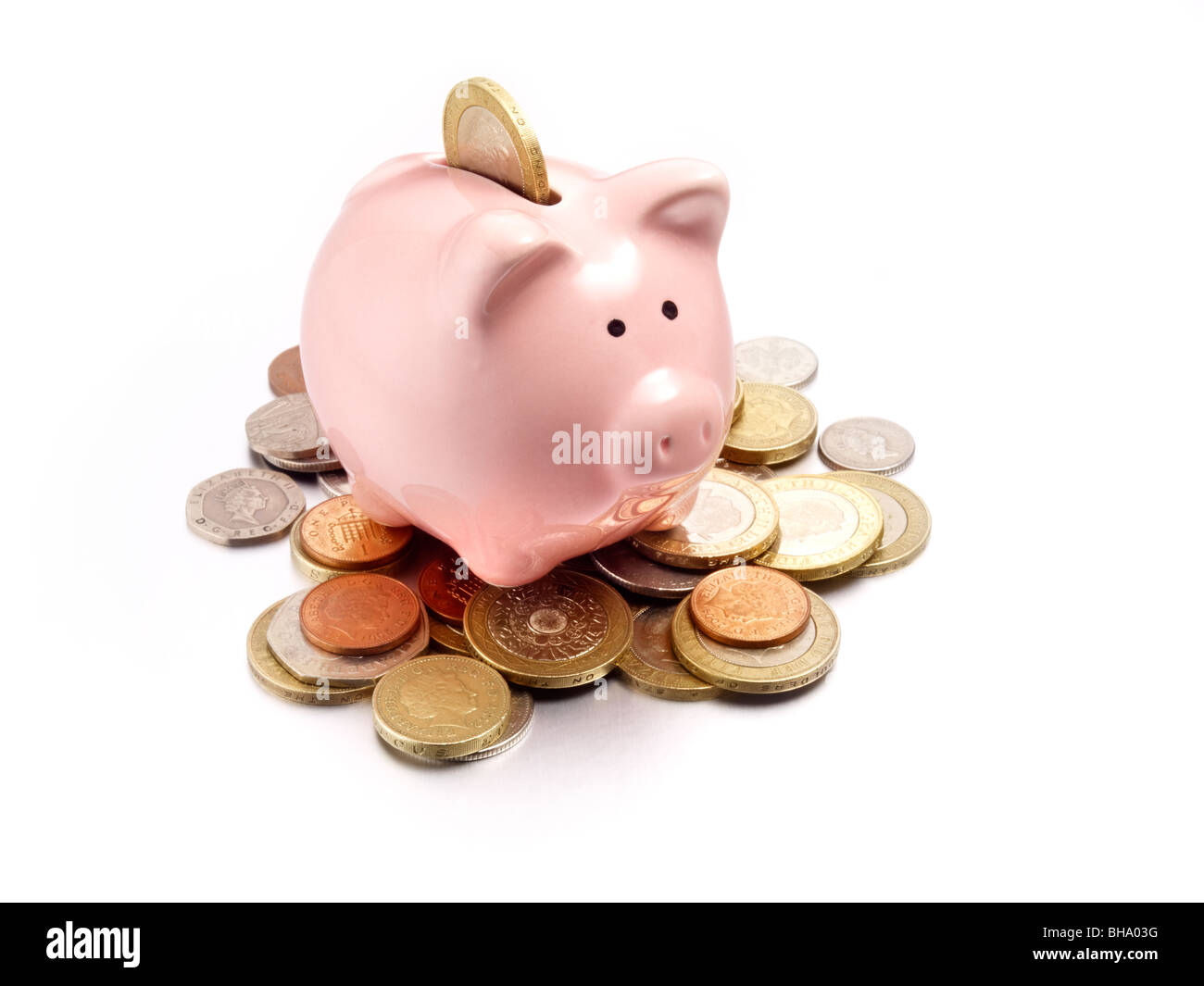 Sparschwein auf Münzen des Pfund sterling Stockfoto