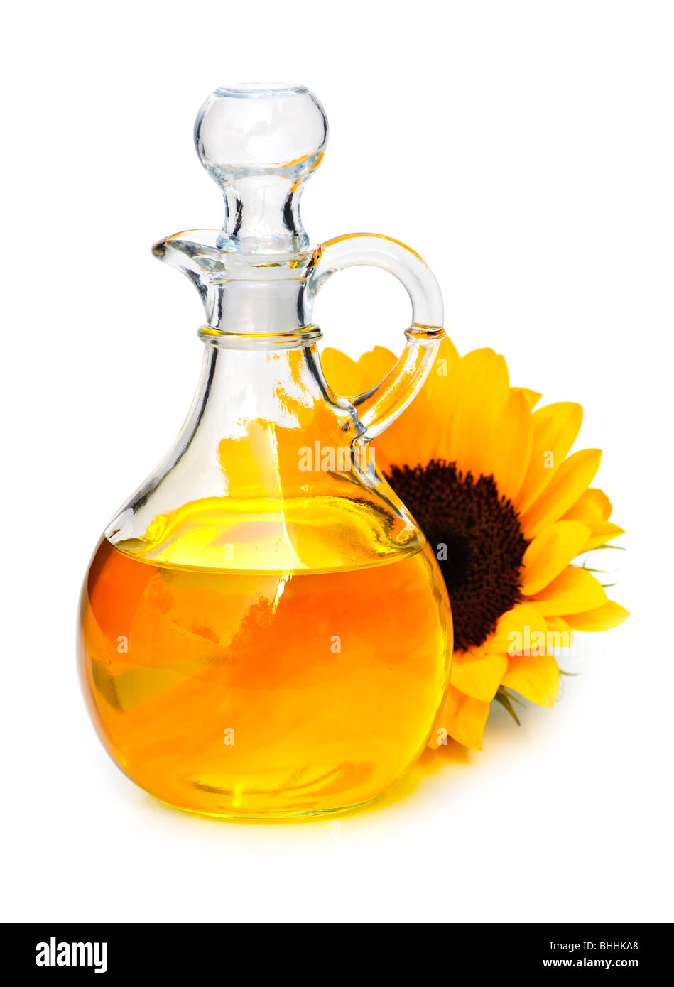 Sonnenblumen-Öl Flasche und Blume isoliert auf weiss Stockfoto