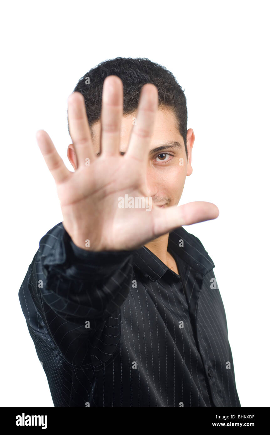 Junger Mann zeigt Hand als einen Stop Geste Ausschnitt vor einem weißen Hintergrund Beirut Libanon Middle East Asia Stockfoto
