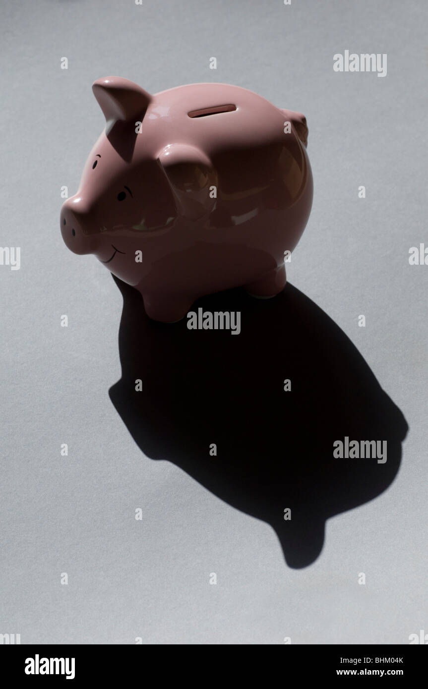 Sparschwein mit einem Schatten Stockfoto