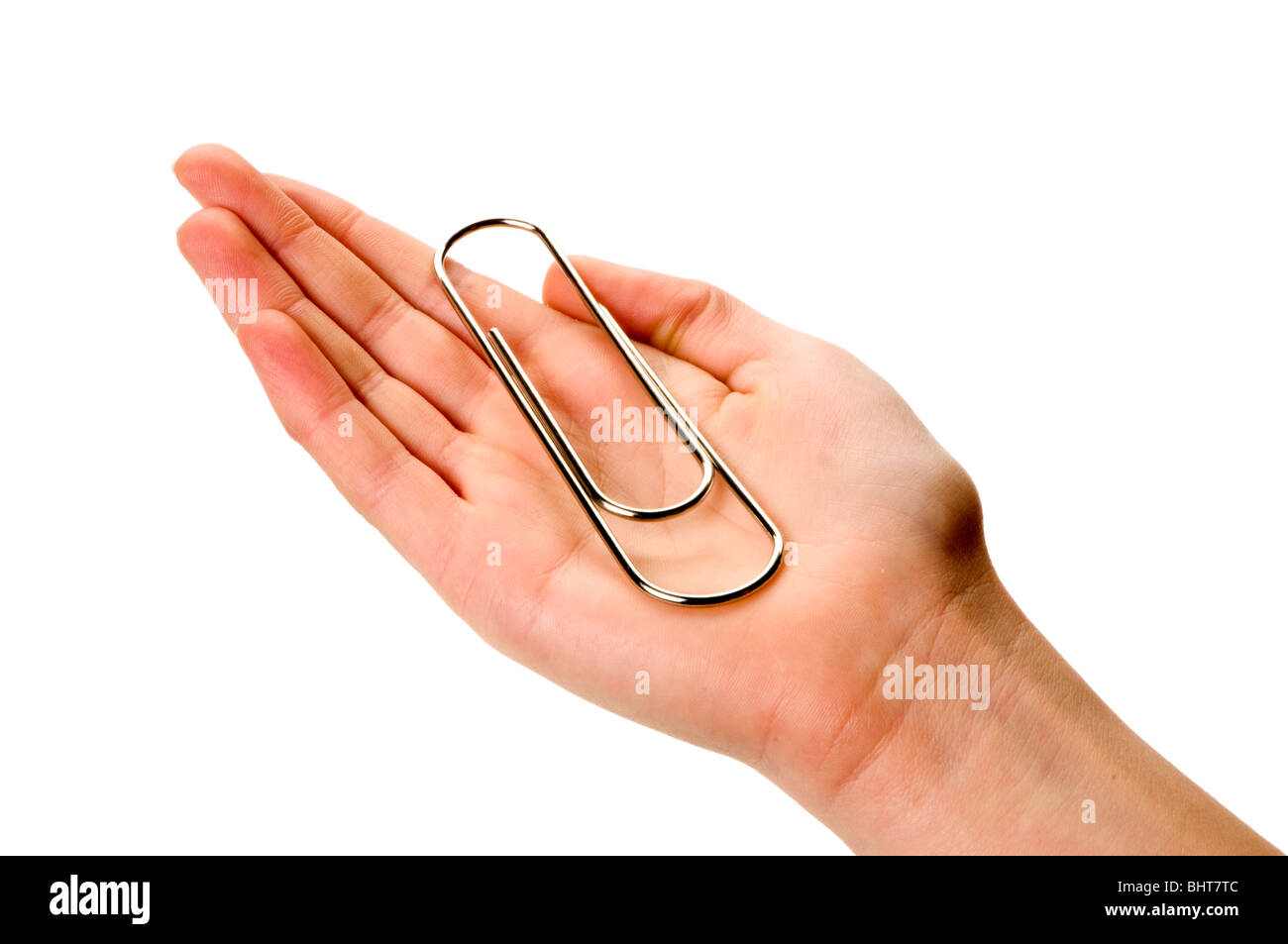 Hand aufs weiße Riese Büroklammer holding Stockfoto