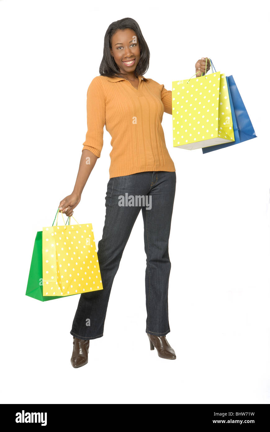 Attraktive Frau mit bunten Einkaufstüten. Stockfoto