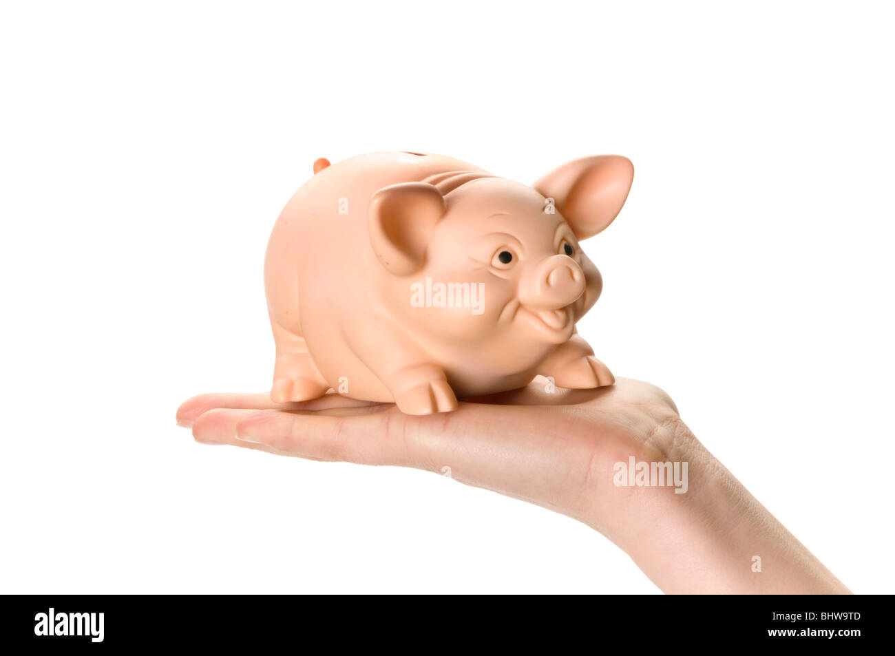 Hand mit Sparschwein und Geld Münze Stockfoto