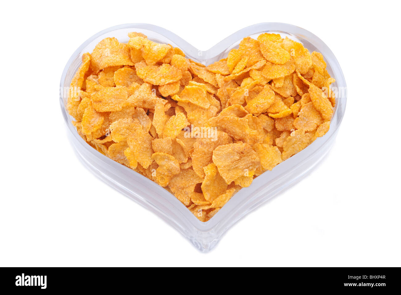 Herzförmige Schüssel mit gesunden Cerealien Stockfoto