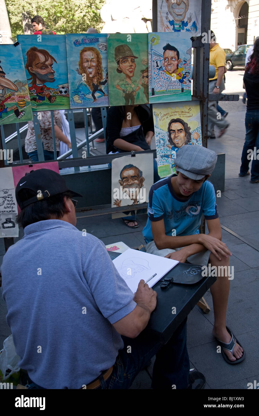 Porträt des Künstlers mit jungen, Plaza de Armas, Santiago, Chile, Südamerika Stockfoto