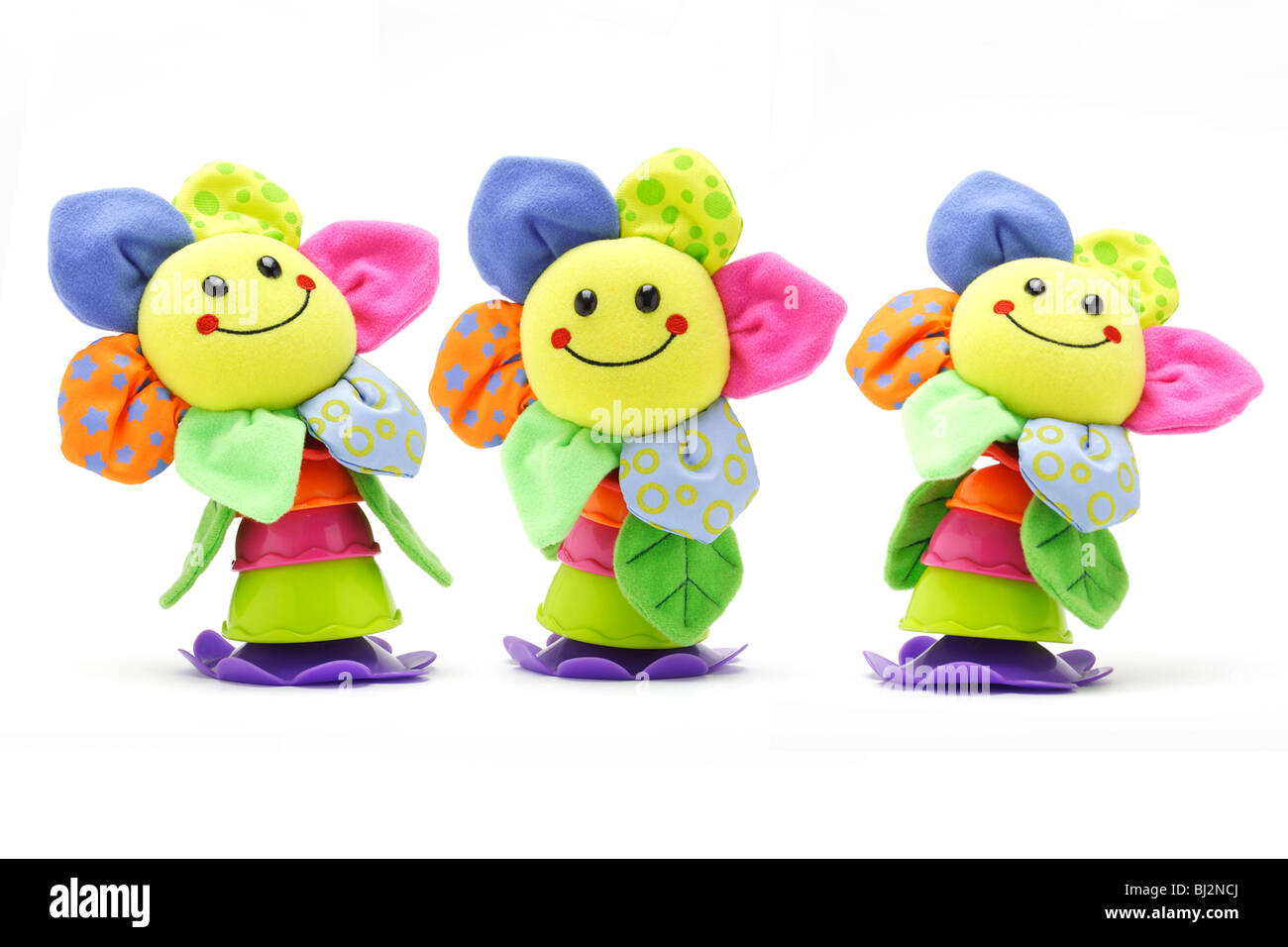 Drei Sonnenblumen Smiley-Gesicht-Puppen auf weißem Hintergrund Stockfoto