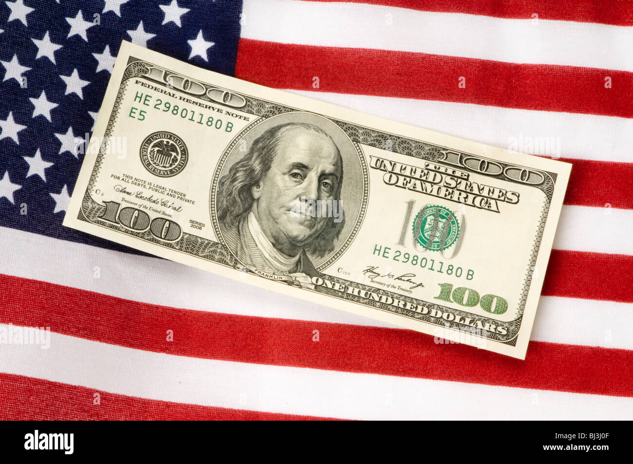 Geld mit amerikanischen Flagge Stockfoto