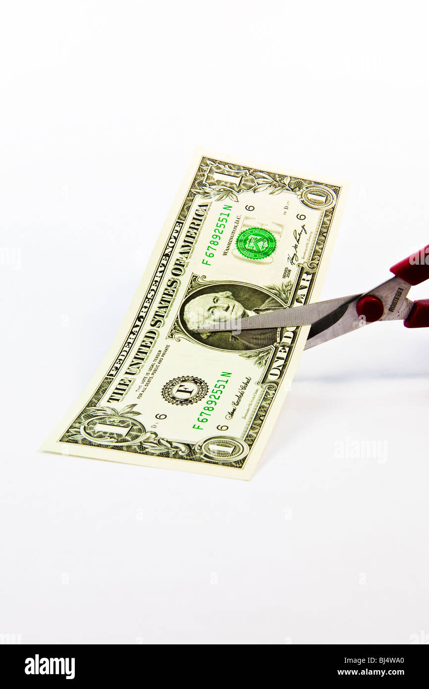 Schere schneiden 1 Dollar Banknote symbolisches Bild der Inflation den Wert halbieren Stockfoto